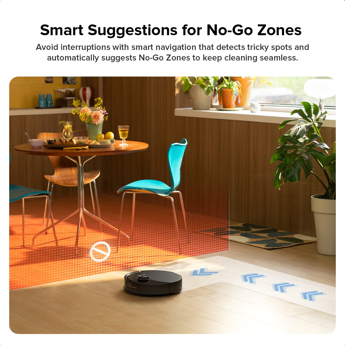 Black Roborock robot vacuum and mop near orange no-go zone boundary lights
