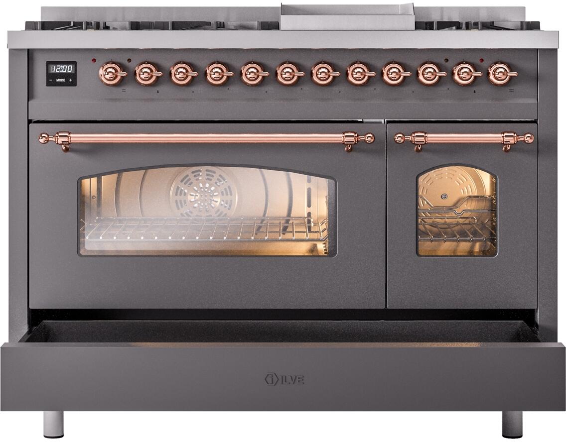 Matte graphite dual fuel range with oven door lowered and control panel with copper knobs.