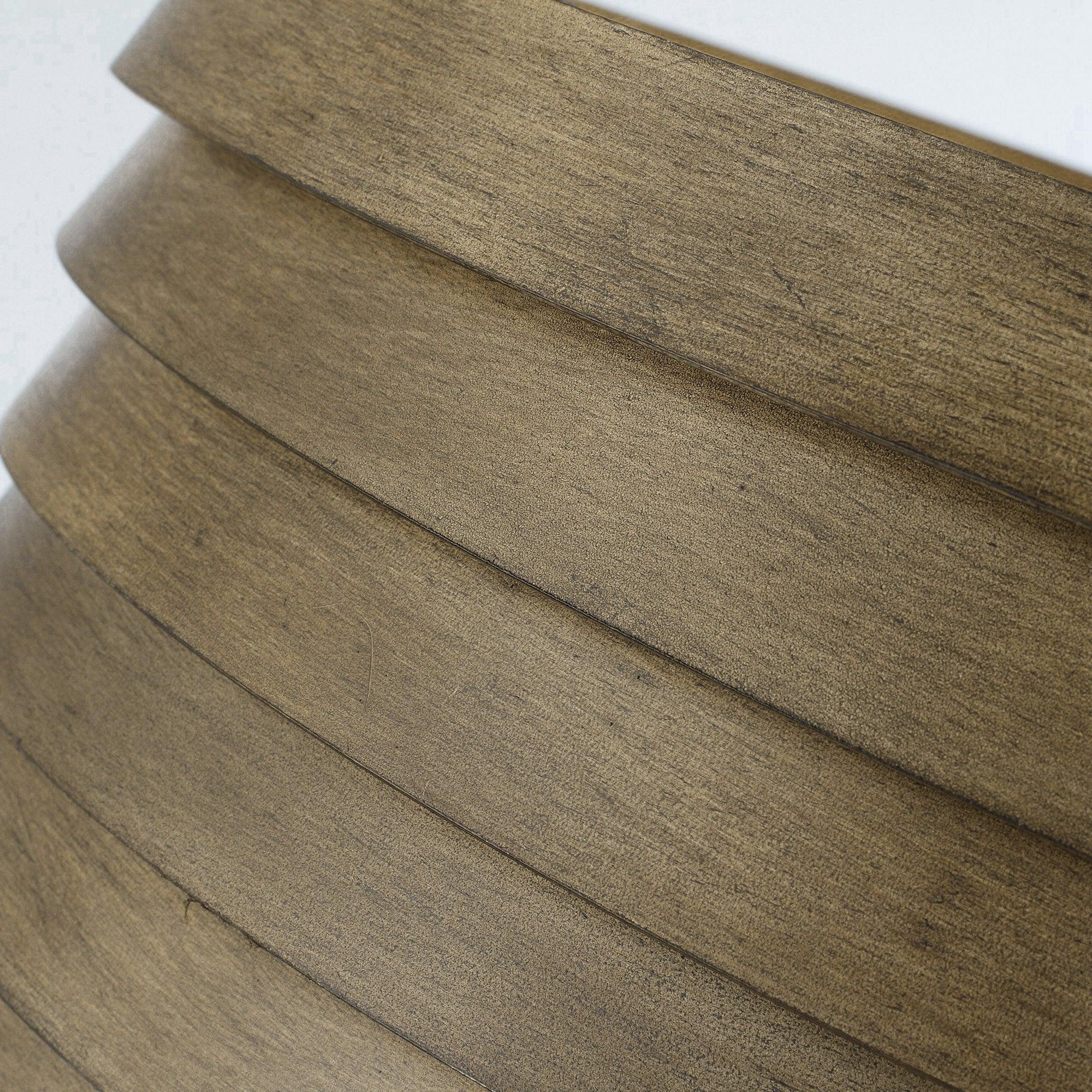 Brown woodgrain ceiling fan blade with stacked panel design