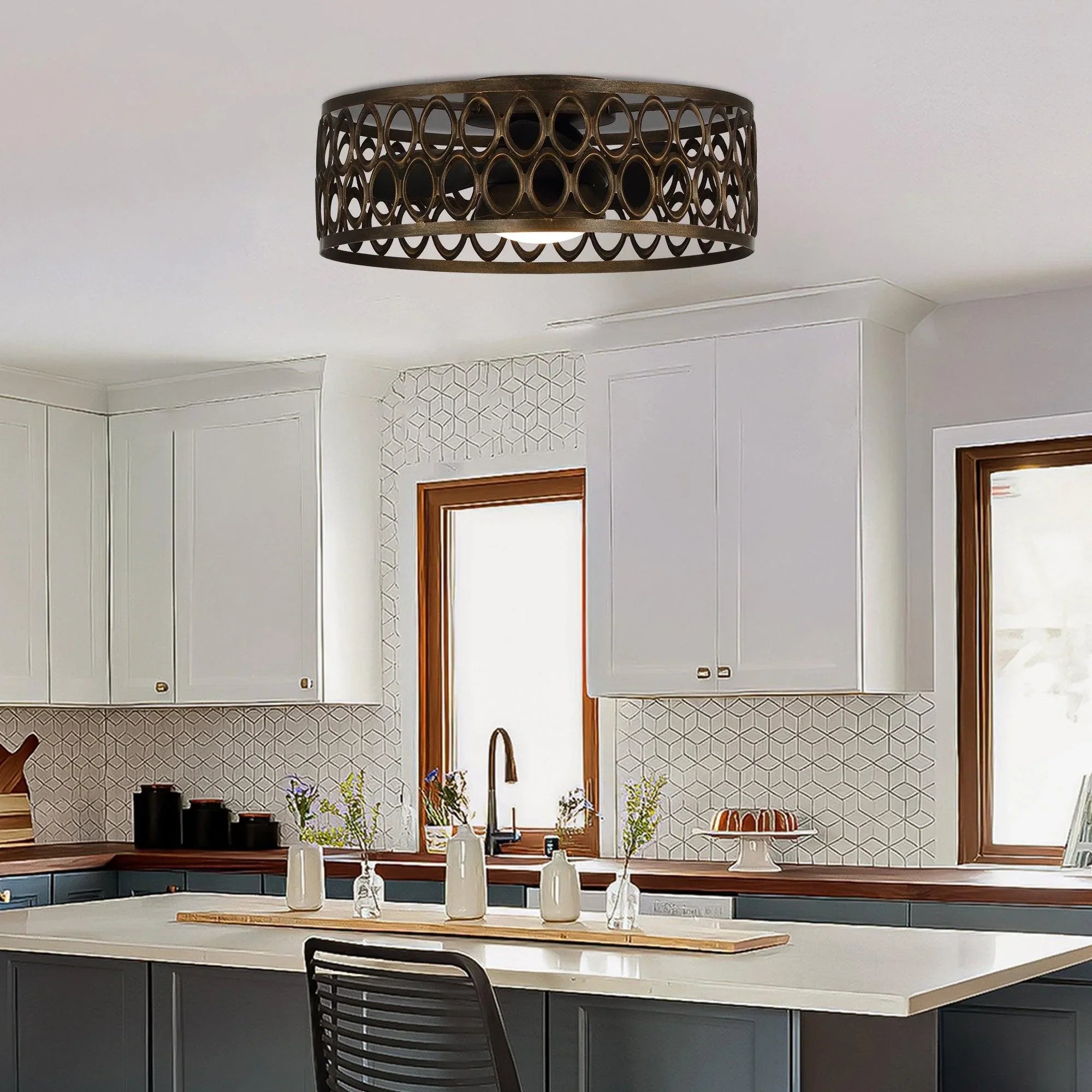 Black flush mount ceiling fan with decorative cage shade and LED light in kitchen