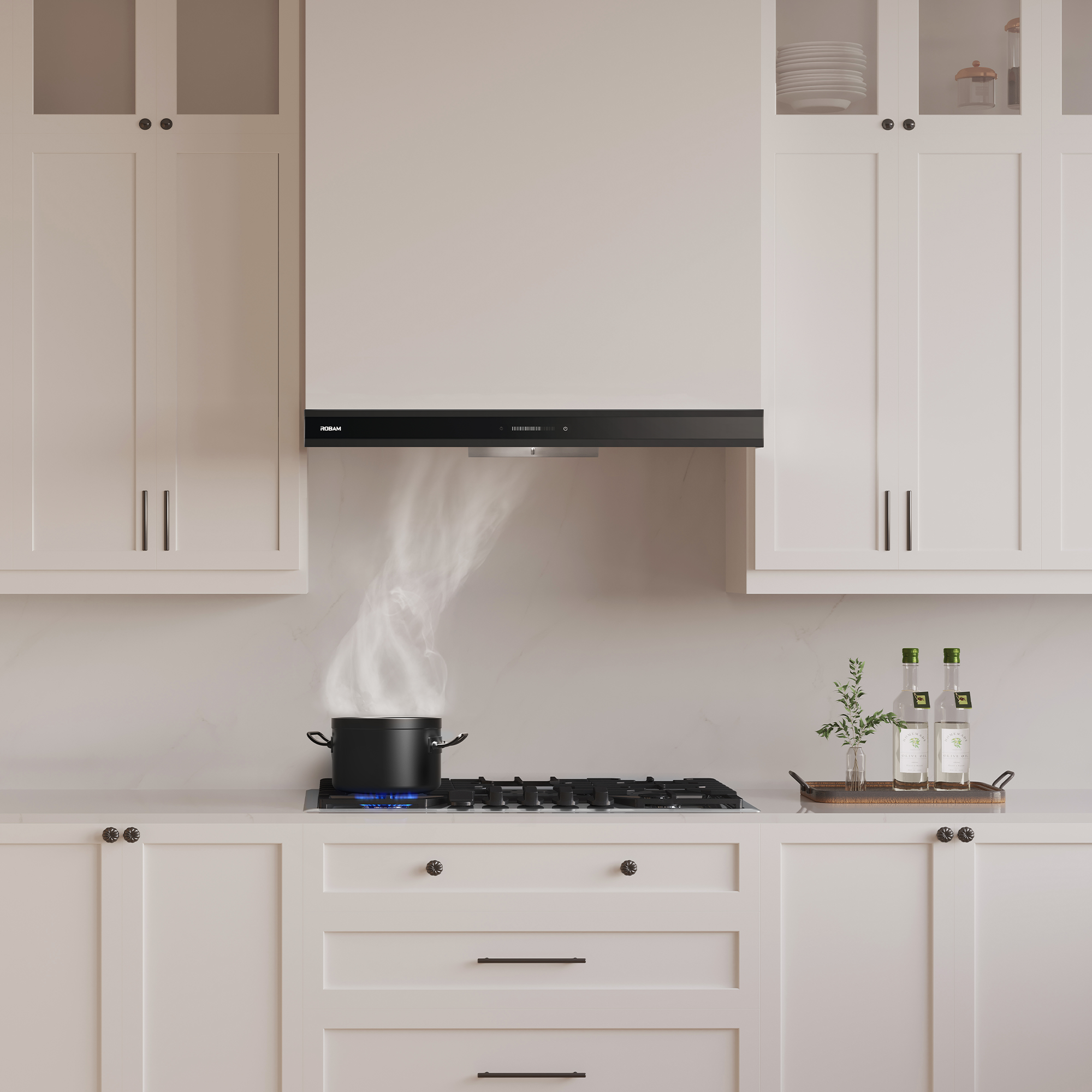 Stainless steel under-cabinet range hood with black front panel above cooktop