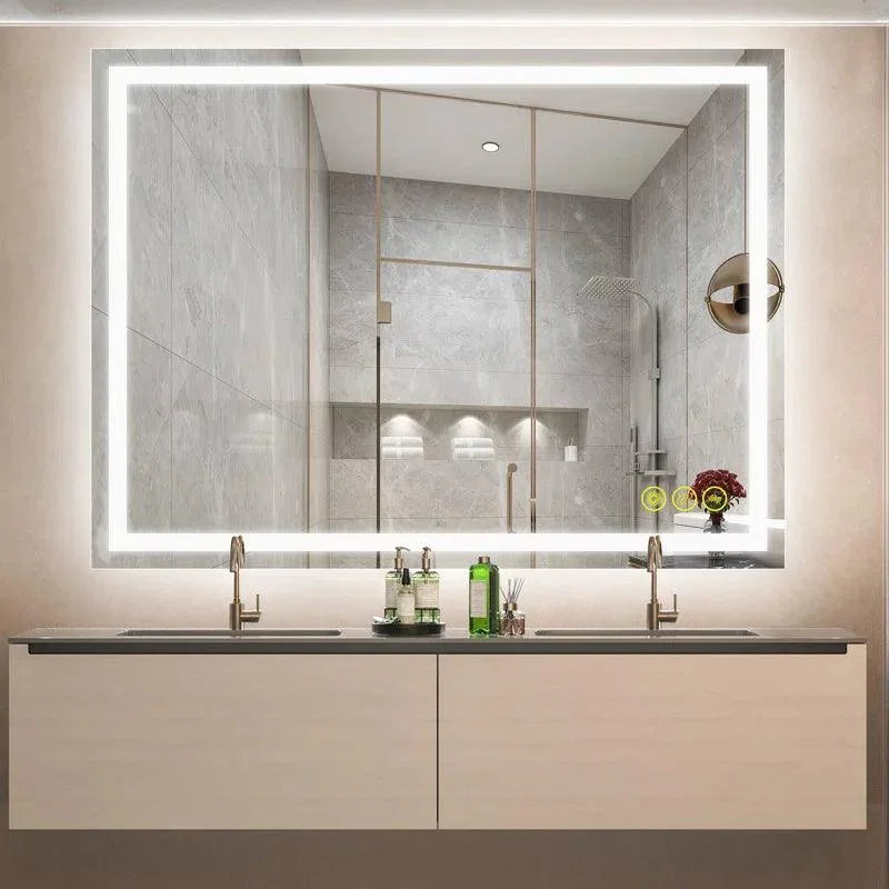 Backlit rectangular bathroom mirror with glowing white LED border and touch controls.