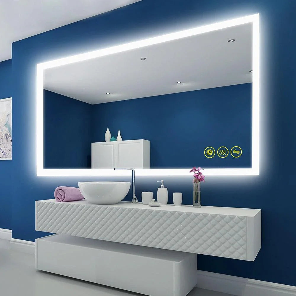Frameless LED mirror with bright border lighting above a white sink and faucet