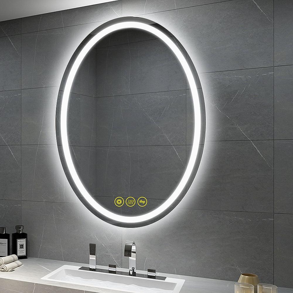 Oval frameless LED mirror with bright backlit ring and control icons on dark glass