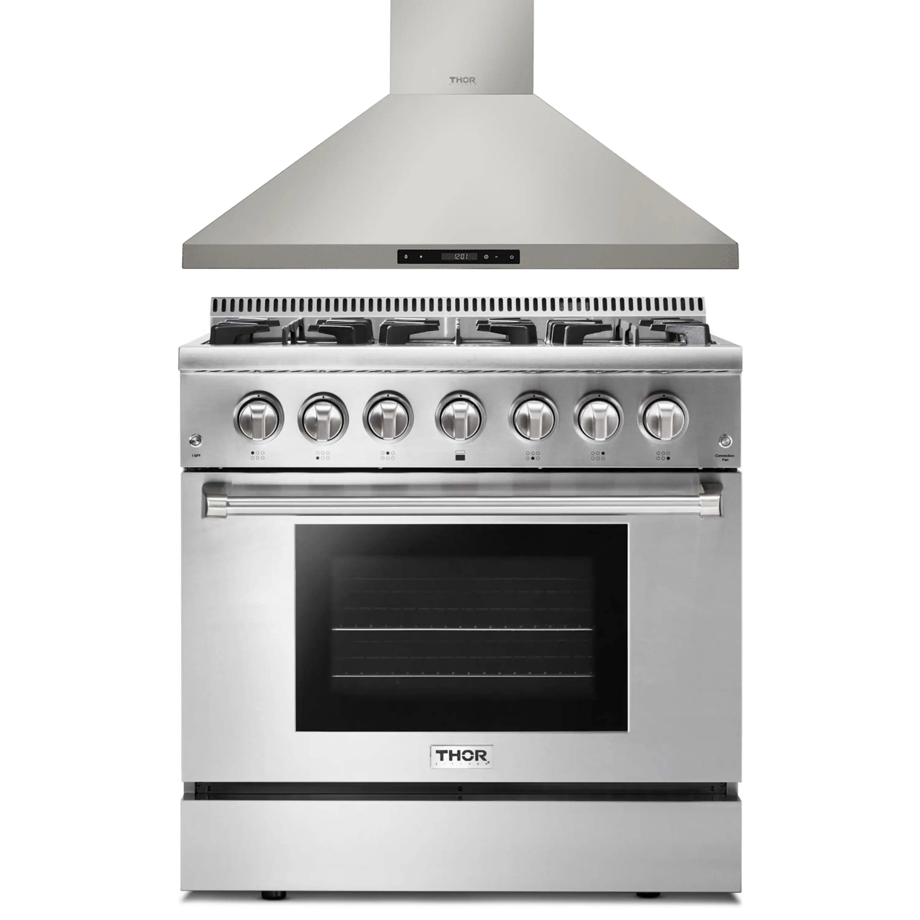 Stainless steel dual-fuel range with wall-mounted hood and control knobs