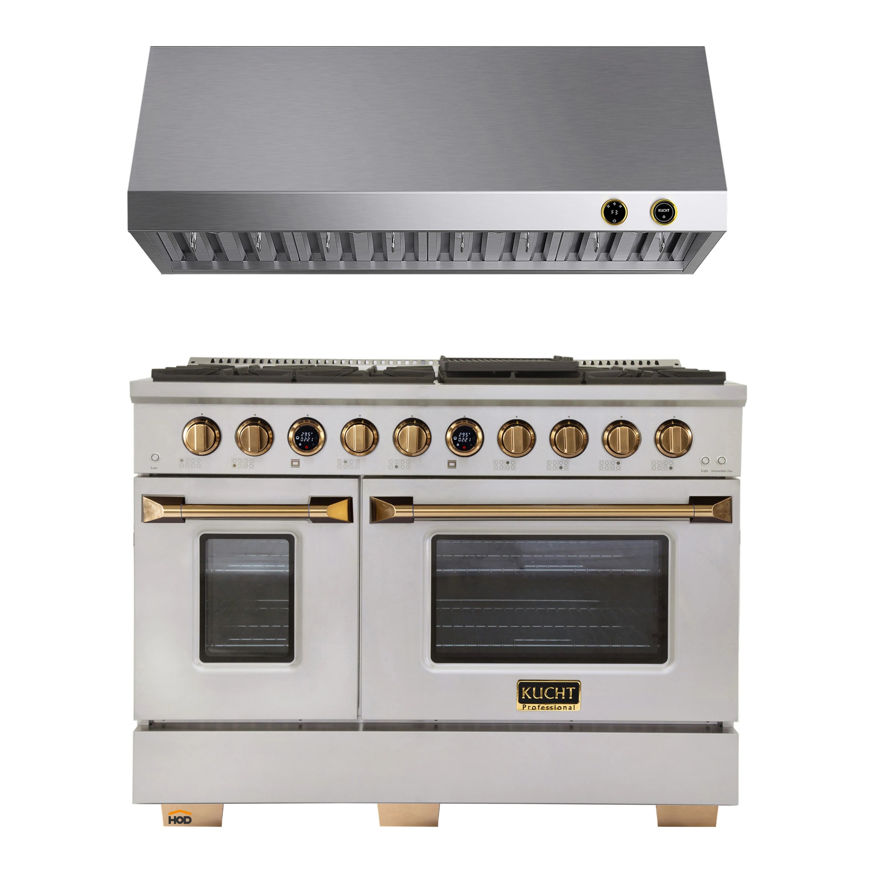 Stainless steel gas range with gold knobs and double oven doors beneath range hood