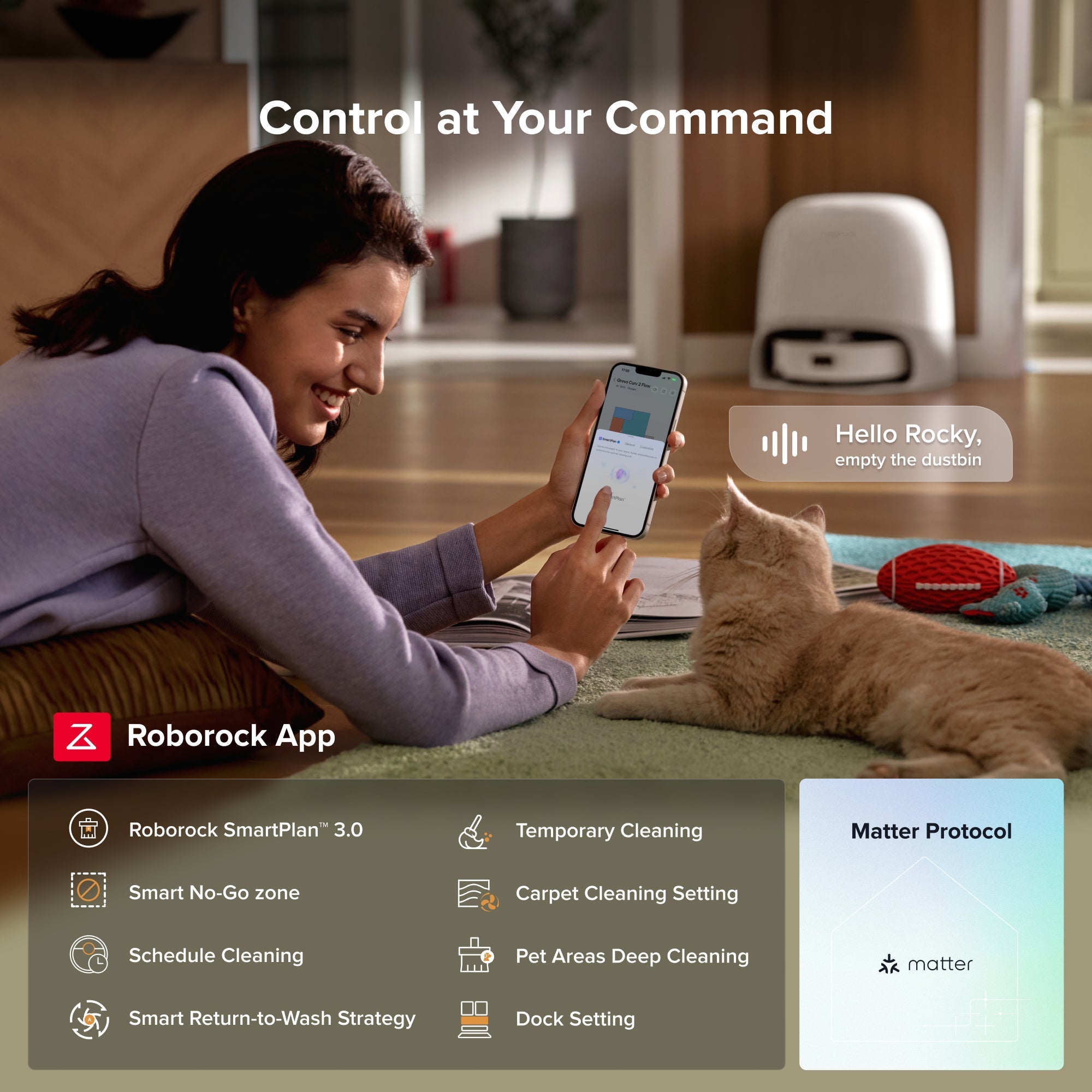 Smartphone with Roborock app controlling robot vacuum next to a relaxed pet