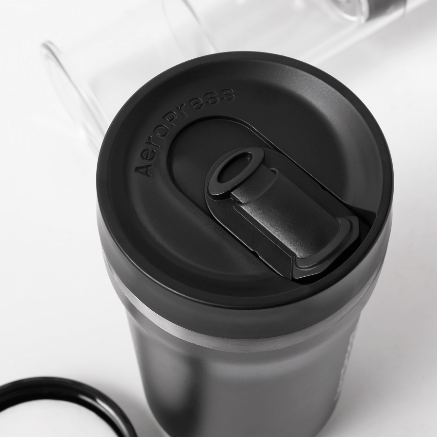 Black AeroPress Go Plus travel tumbler lid with filter assembly