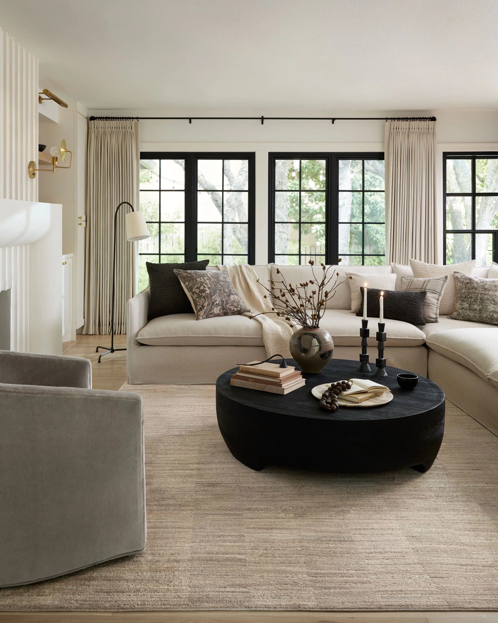 Natural and pebble area rug under living room furniture, abstract linear texture