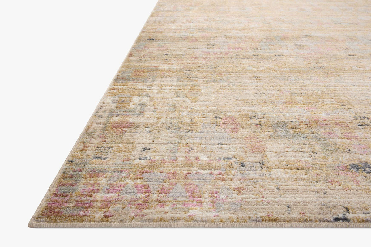 Sand beige accent rug with distressed multicolor pattern and low-profile border