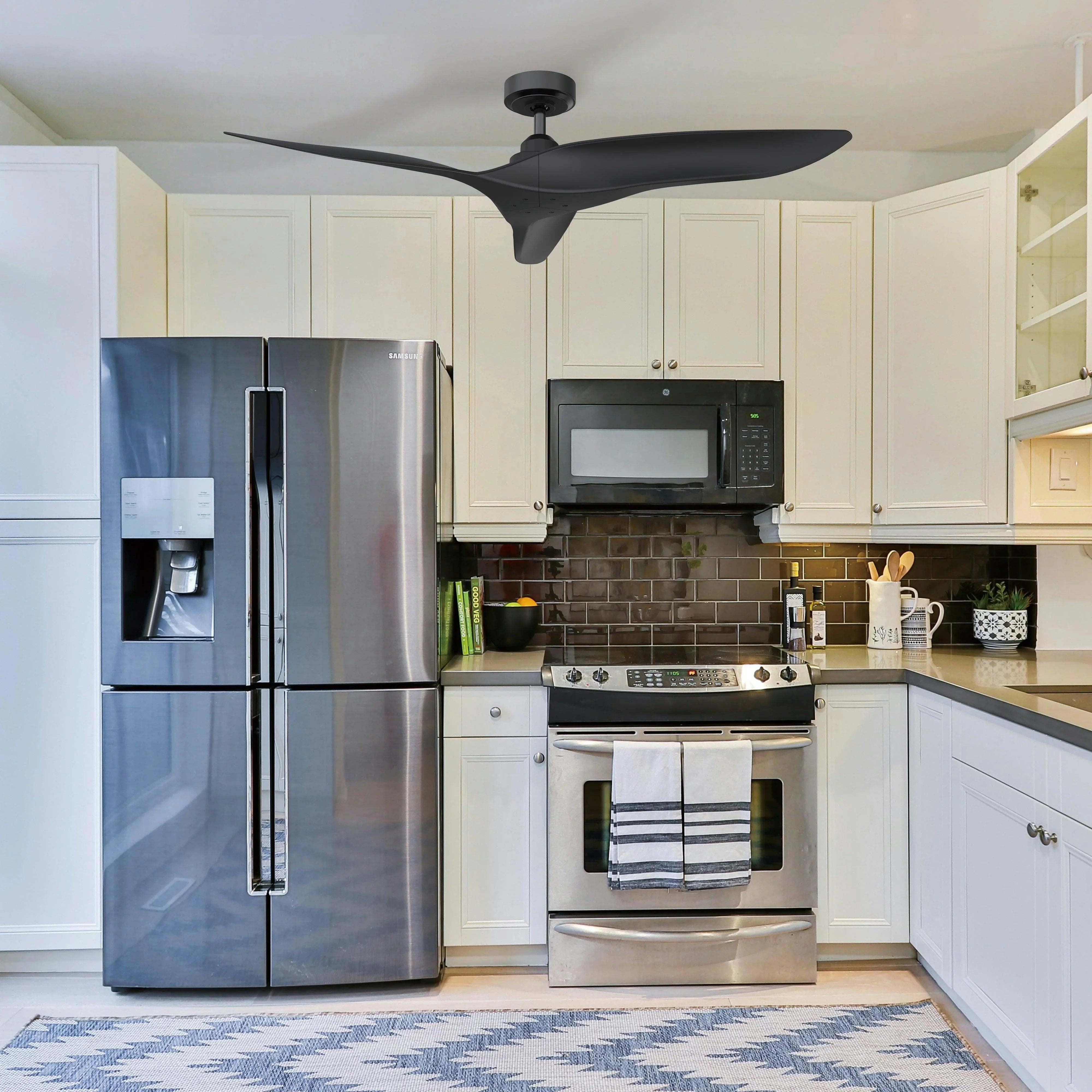Ceiling fan with reversible blades and downrod mount, dark fan