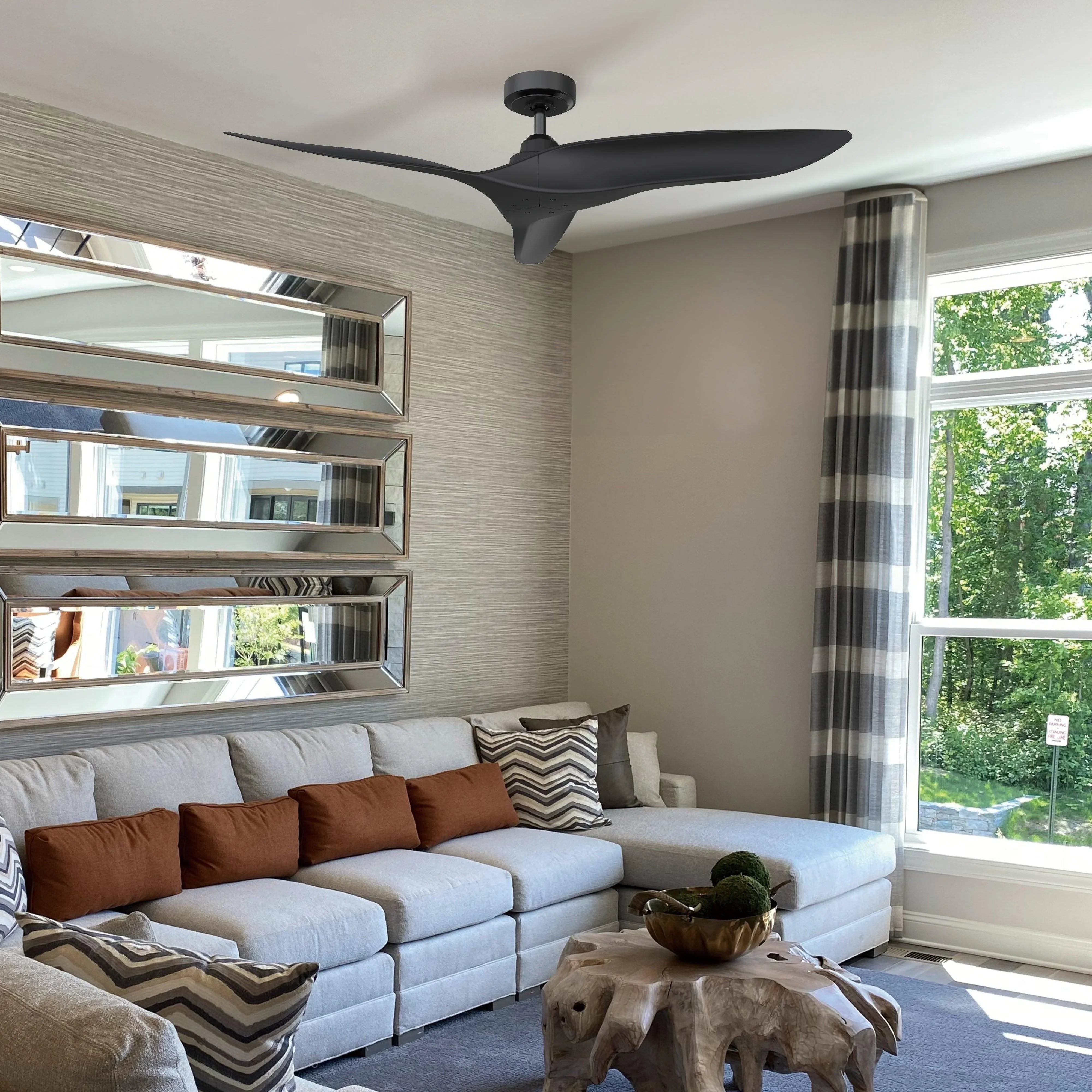 Ceiling fan with DC motor, dark reversible blades against the ceiling