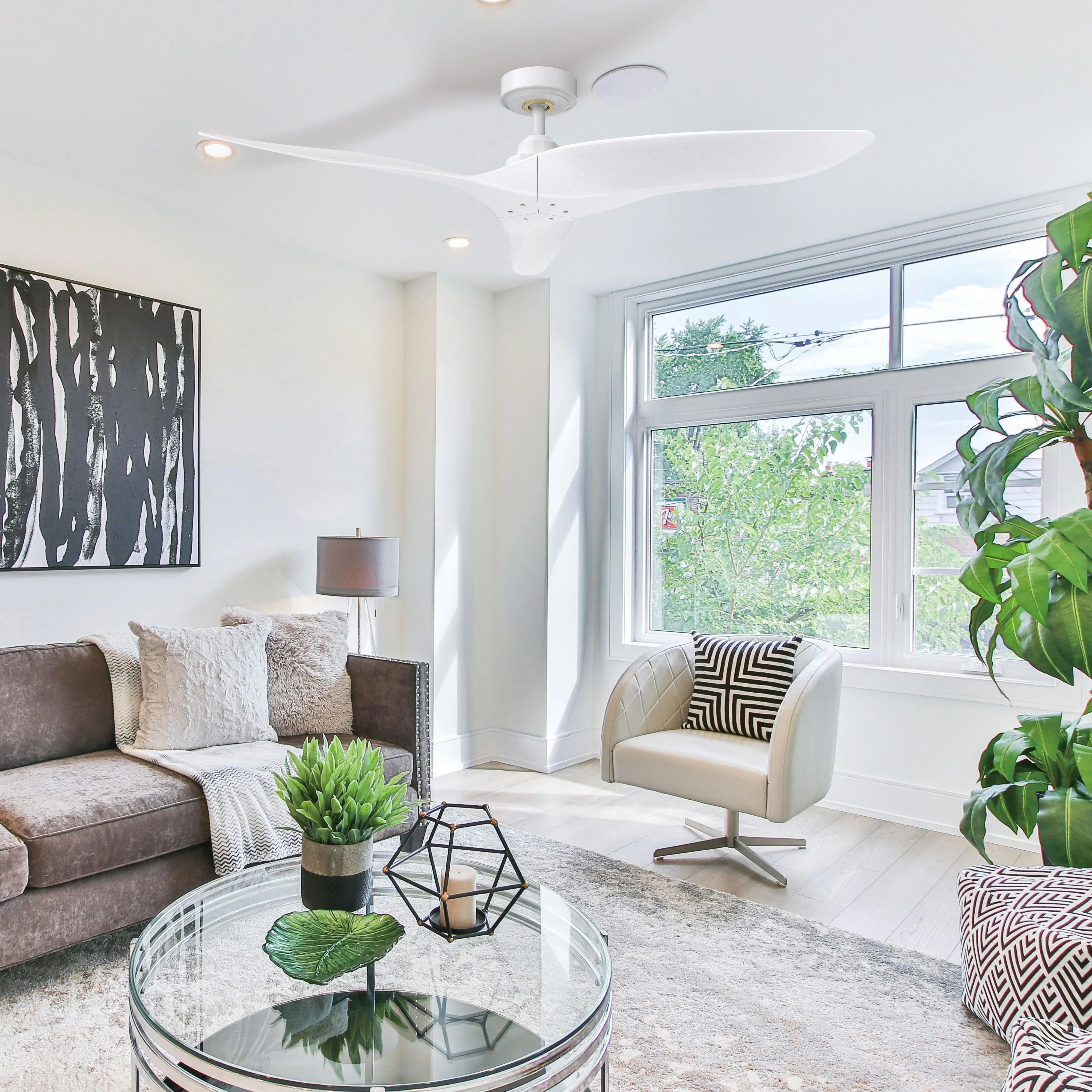 White ceiling fan with three blades and ceiling canopy mount in a lounge room