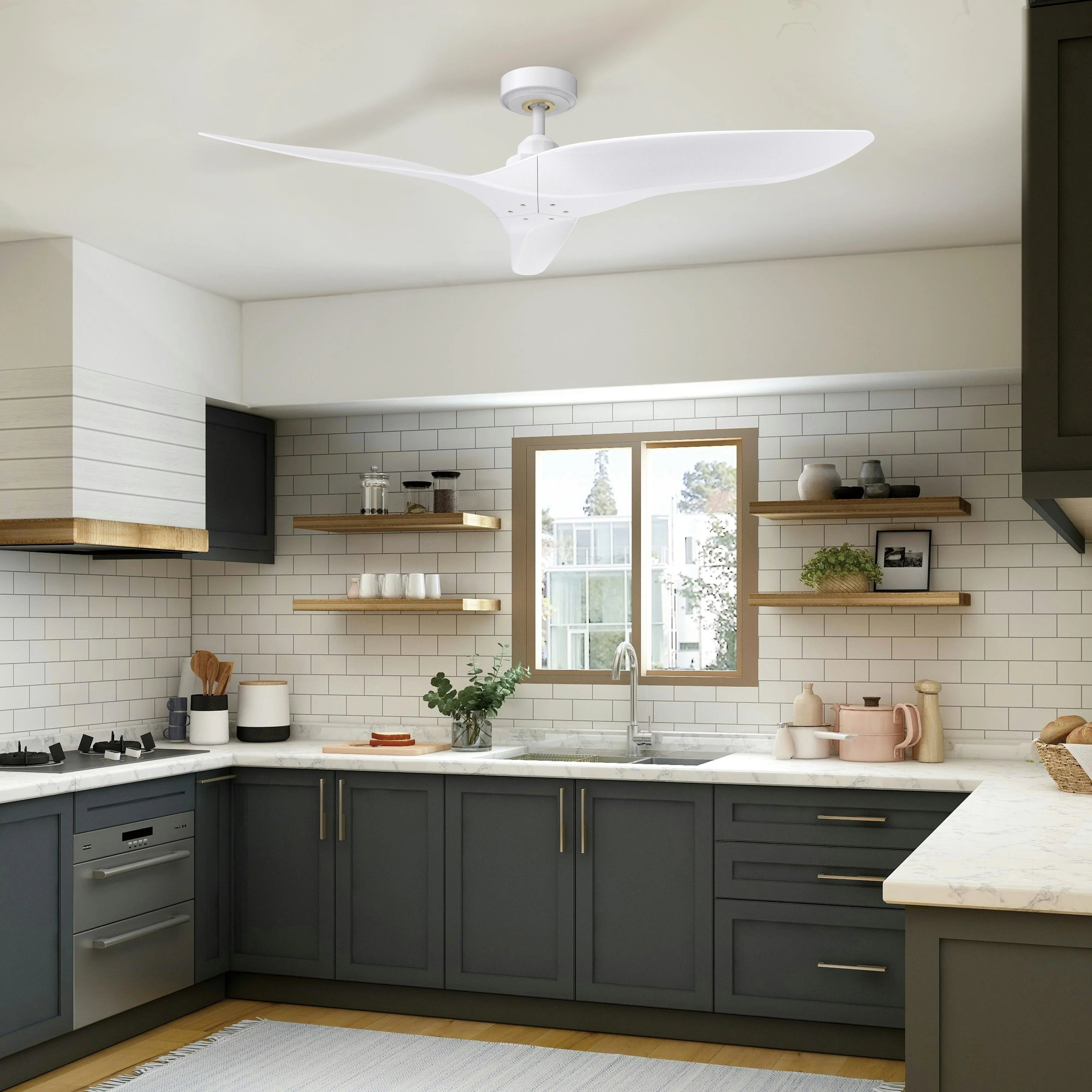 White ceiling fan with three blades and canopy mount above a kitchen workspace