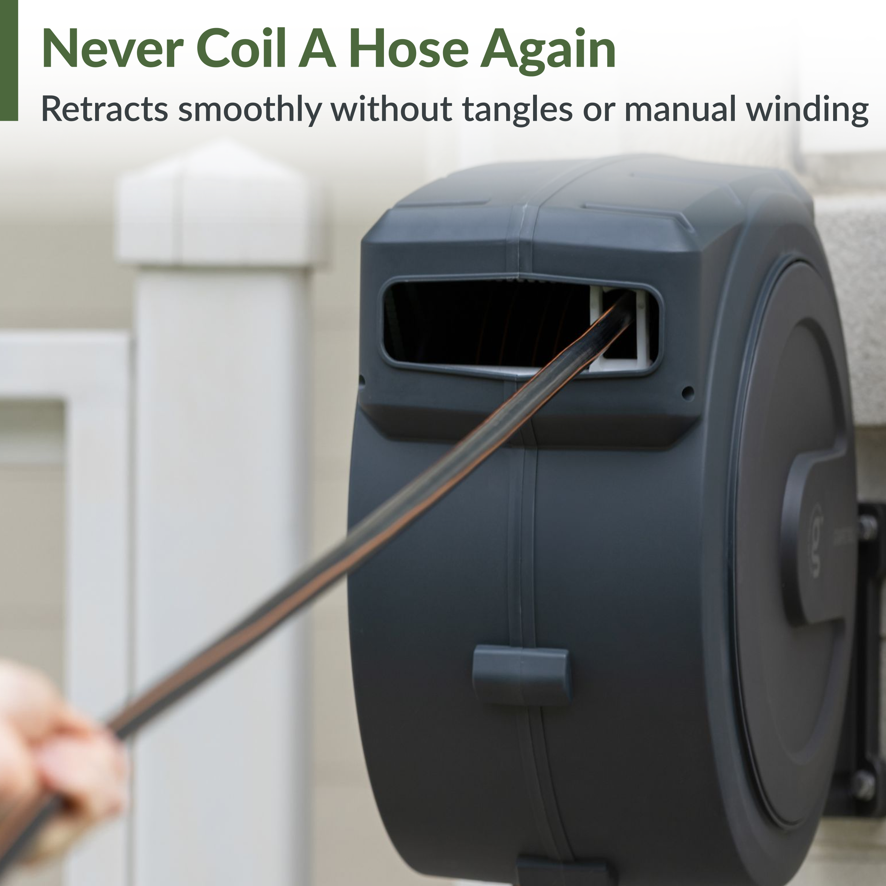 Retractable garden hose reel with hose entering the housing; dark gray wall-mount style