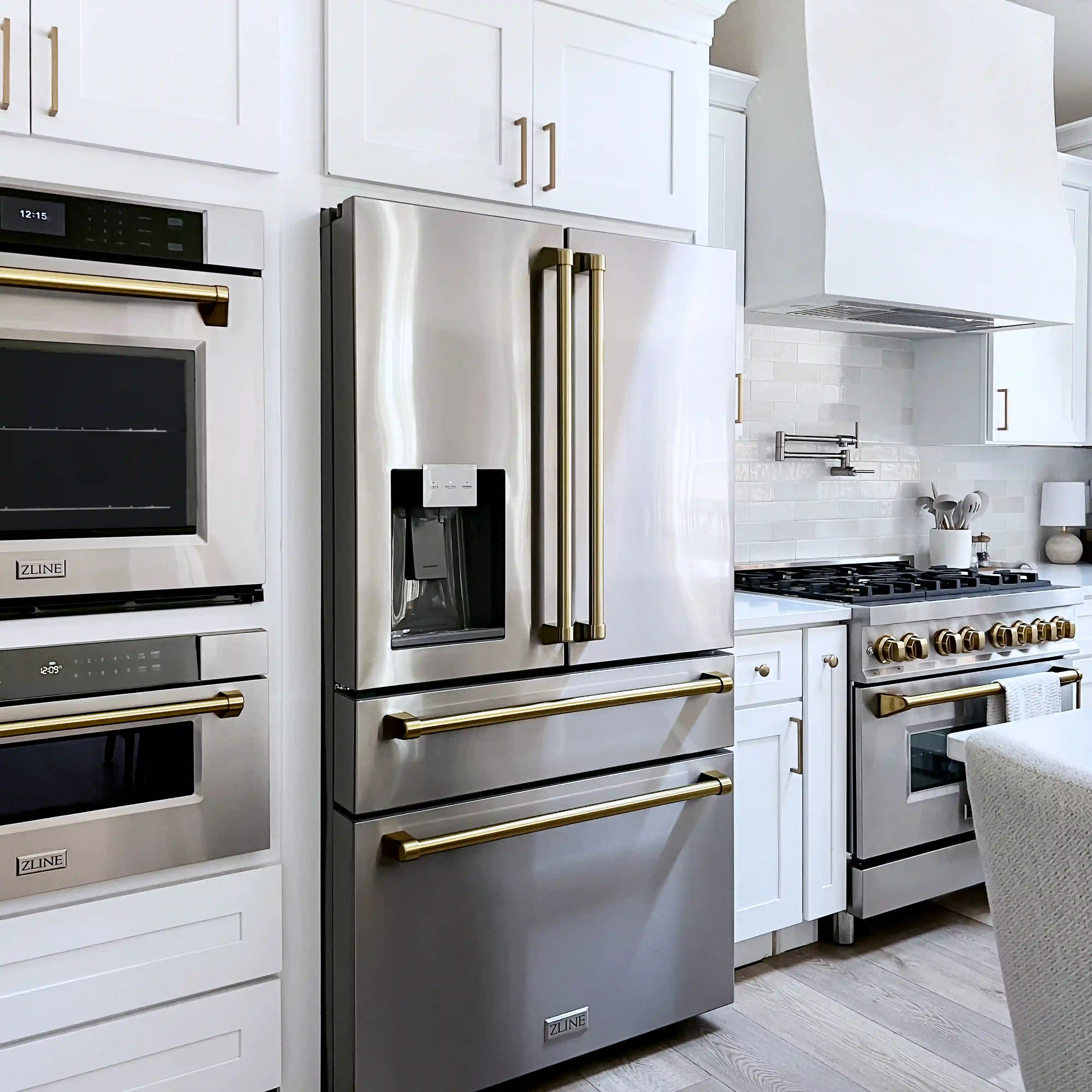 Stainless steel freestanding French door refrigerator with water/ice dispenser and bronze handles