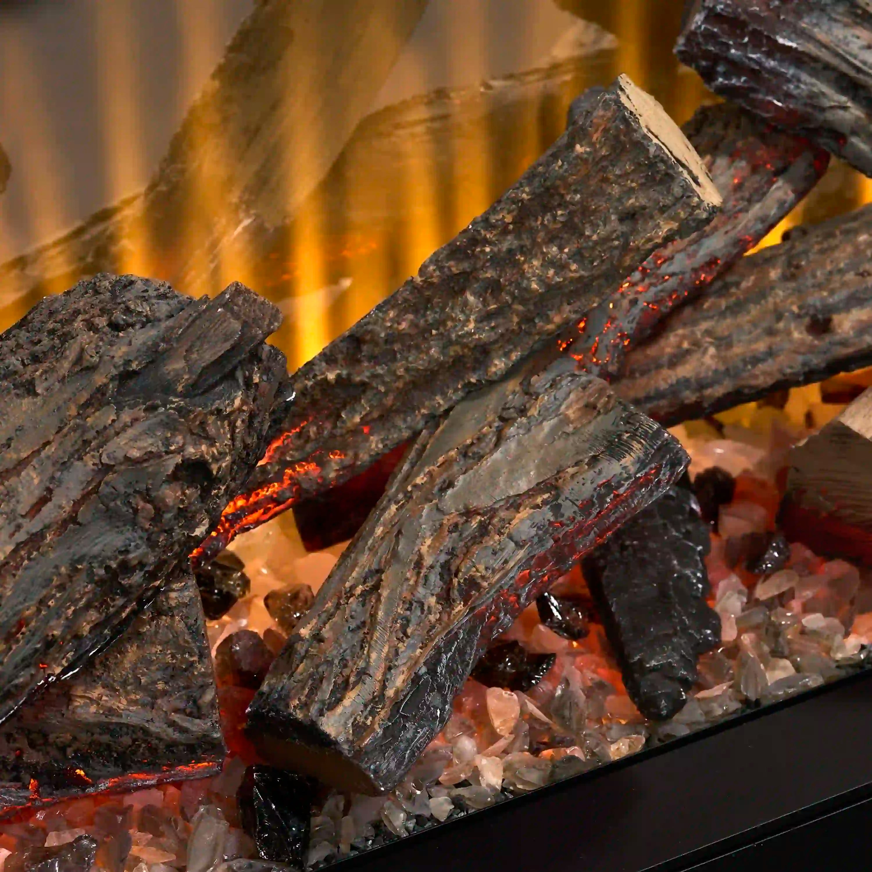 Close-up of glowing logs and embers in an electric firebox