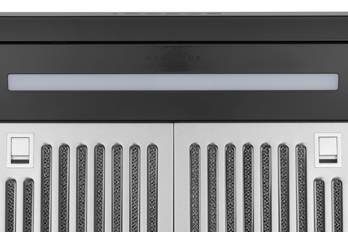 Black under-cabinet range hood control area with switches and vent grille openings
