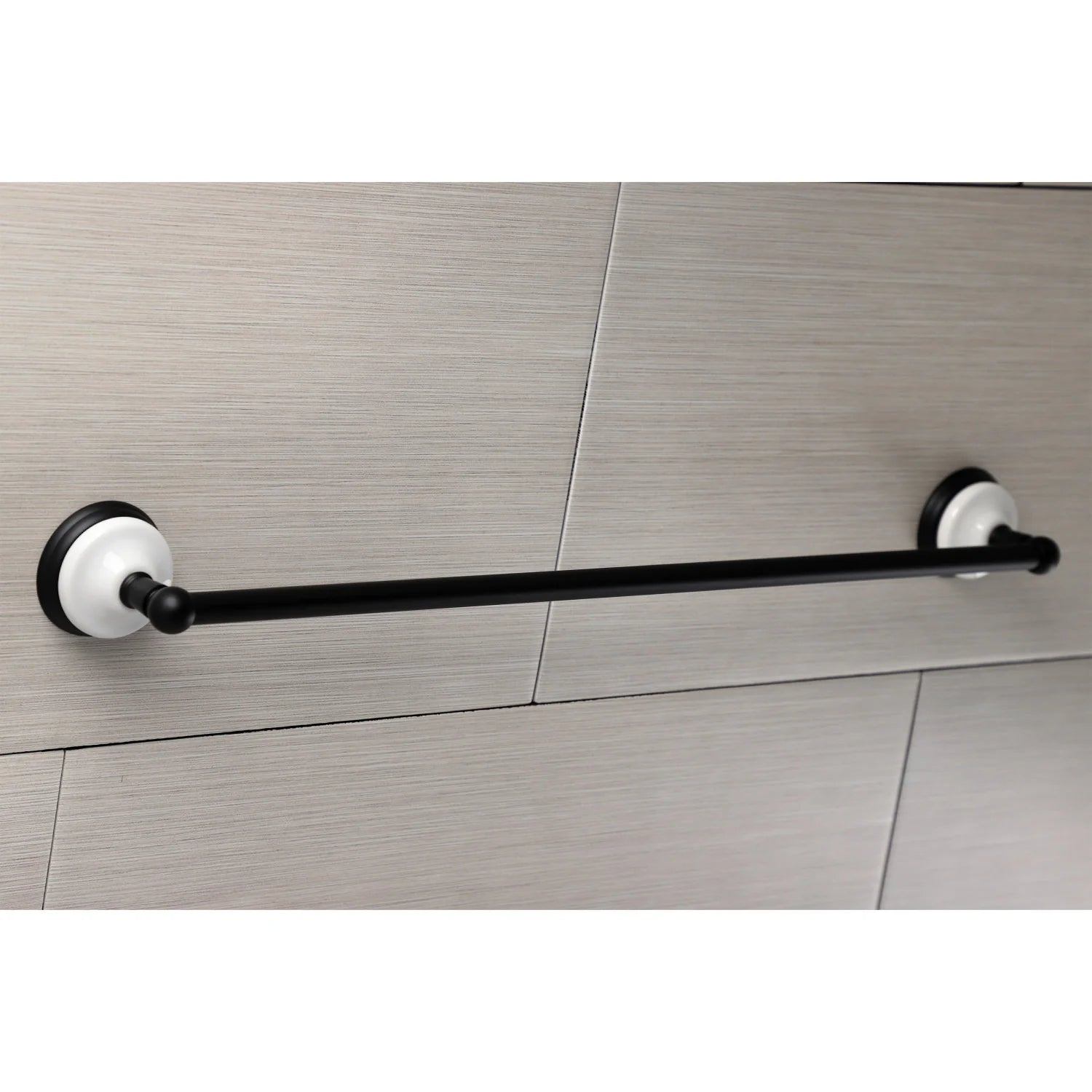 Single towel bar on tiled wall, matte black bar with white mounting flanges