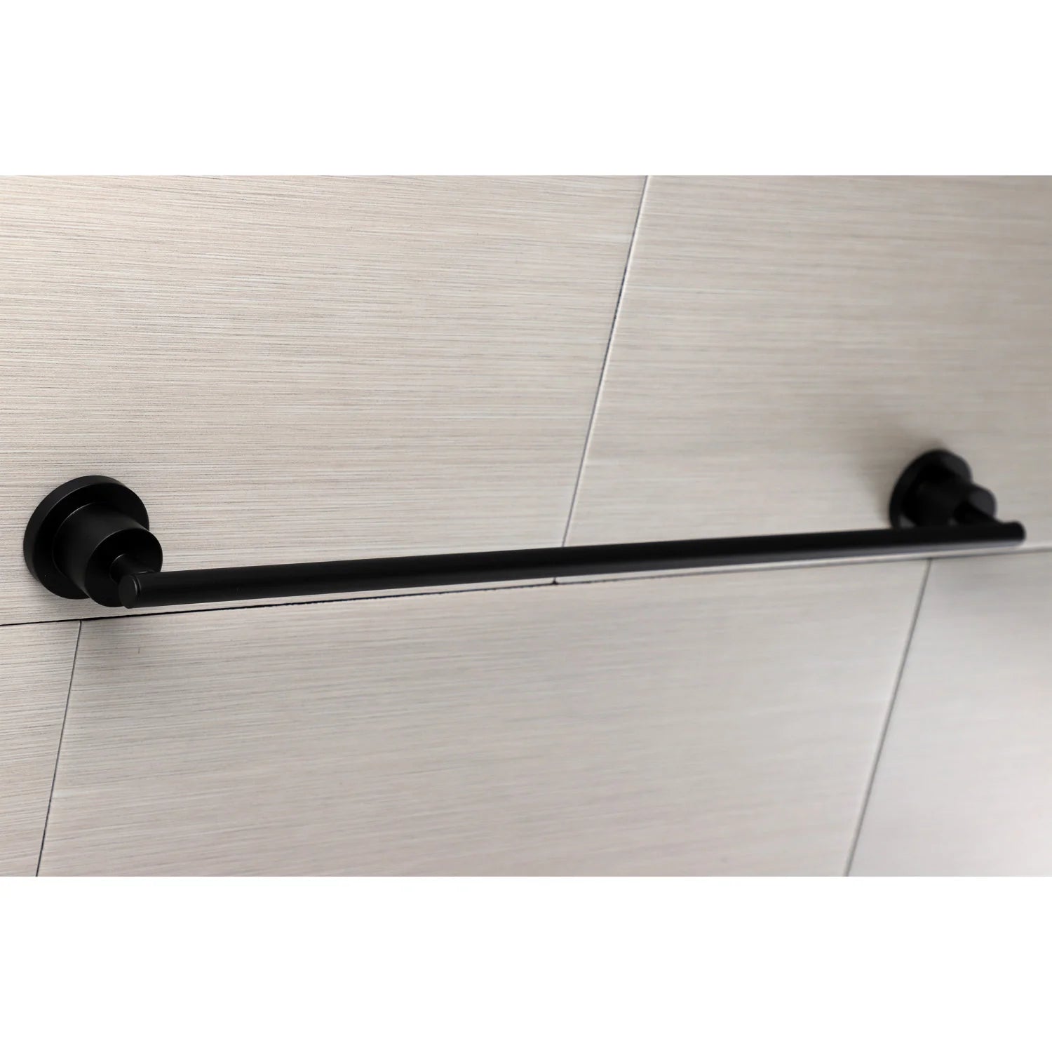 Matte black wall-mounted towel bar with end brackets on tile