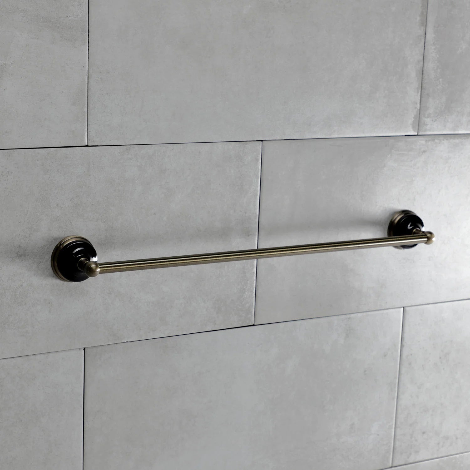 Single towel bar in antique brass with two round end mounts for wall