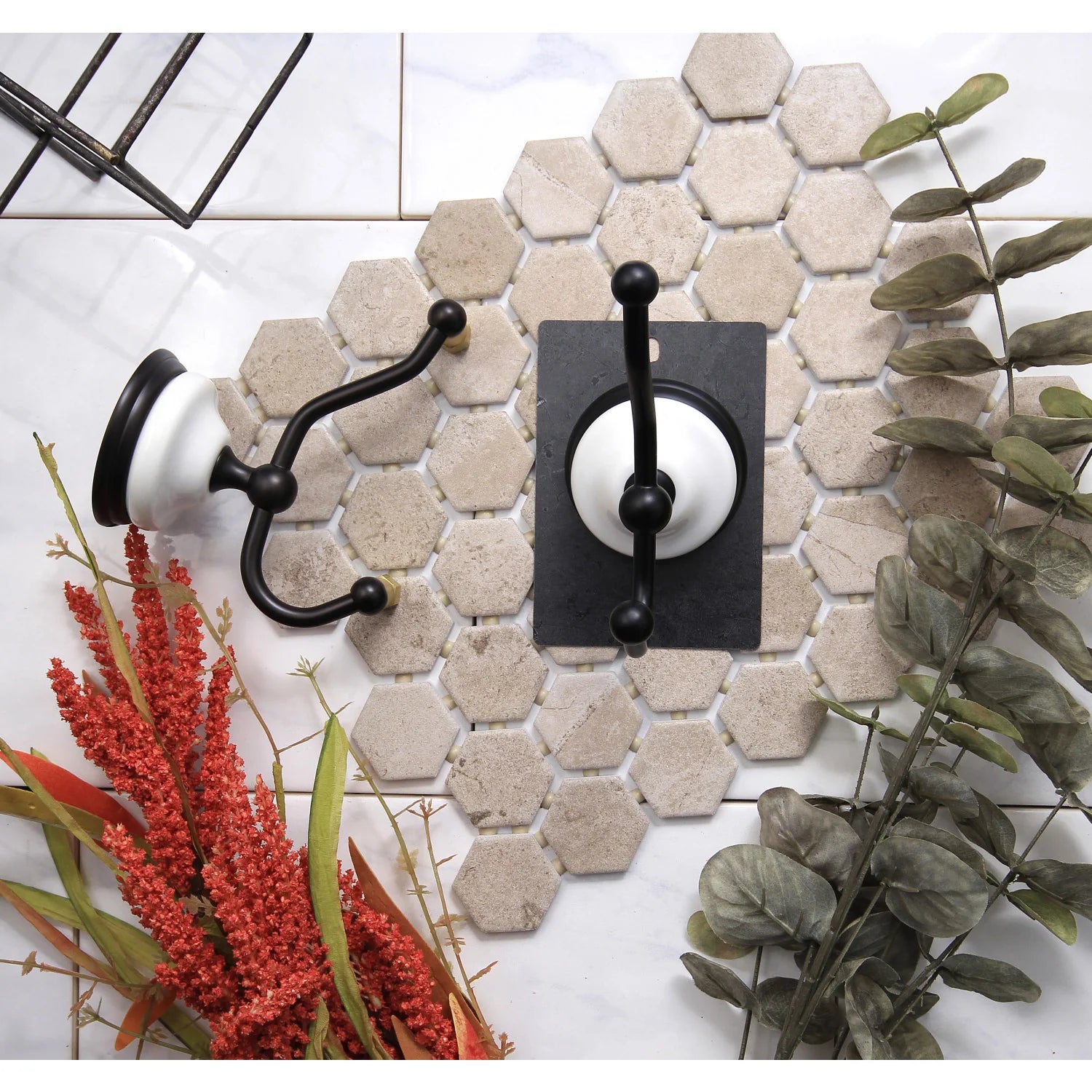 Two-piece Victorian robe hook set with oil-rubbed bronze hooks on tile wall