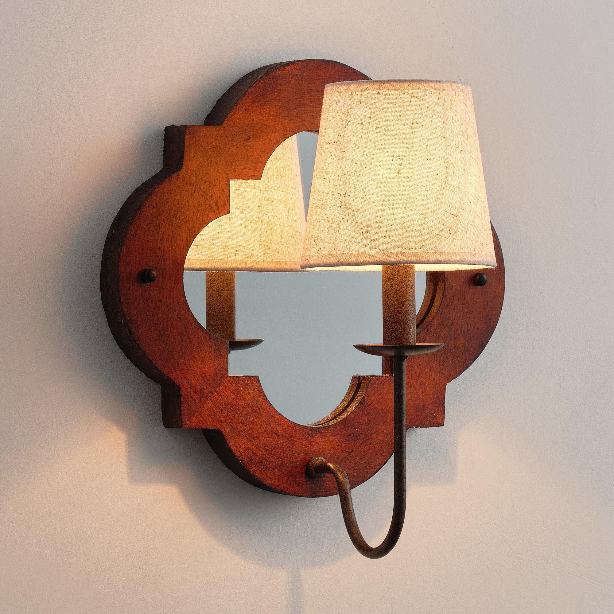 Rustic brown wall sconce with two fabric shades and curved hanging-style metal cord