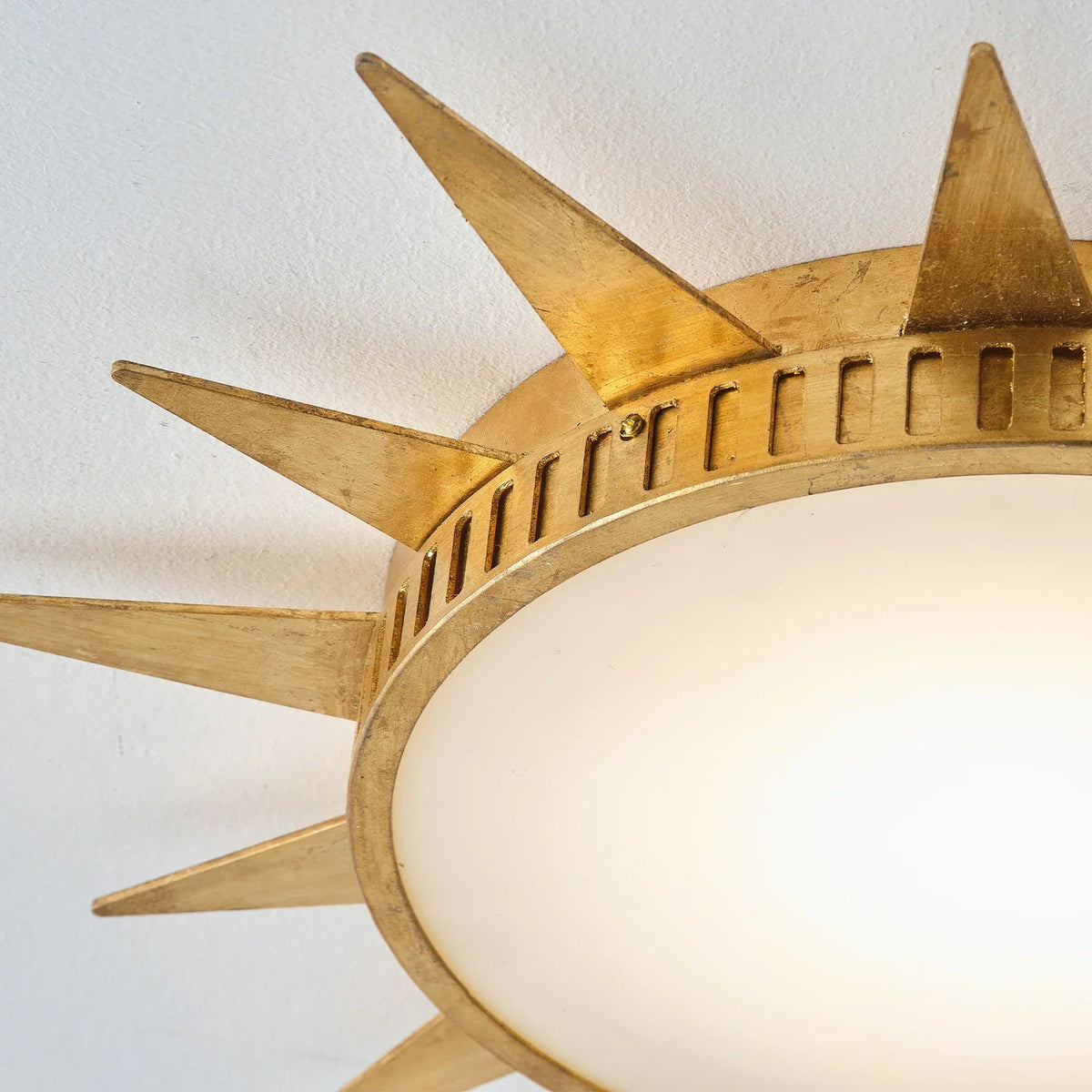 Golden sunburst flush-mount LED ceiling light with acrylic dome and star arms