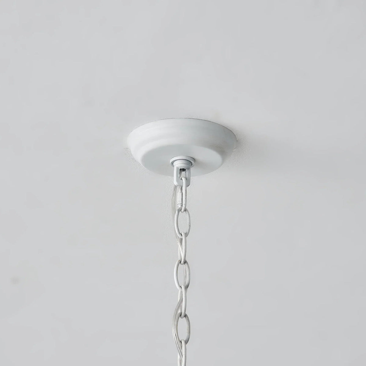 White ceiling canopy with hanging chain for wooden cylinder 5-light chandelier