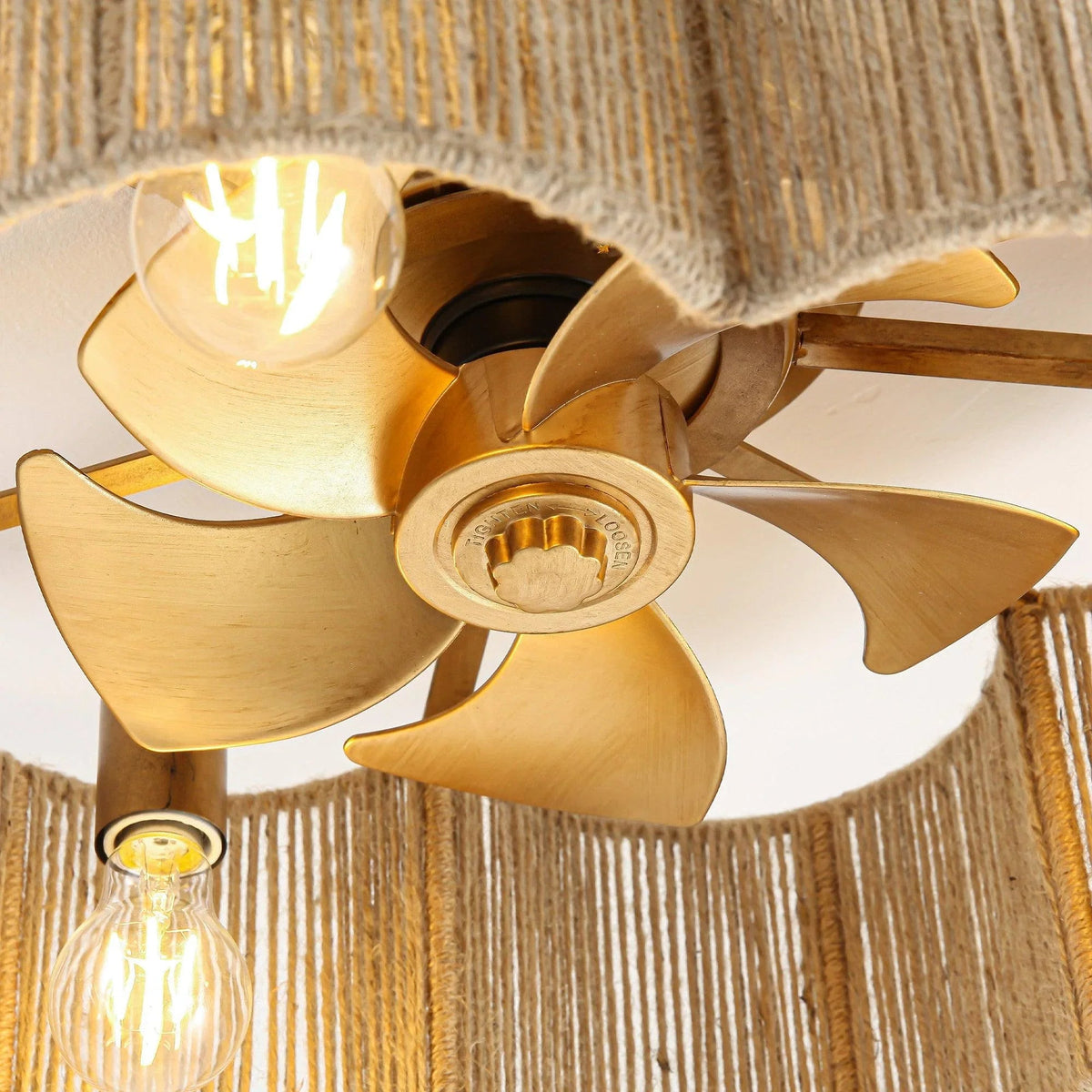 Golden rattan flush mount ceiling fan with light and four curved blades