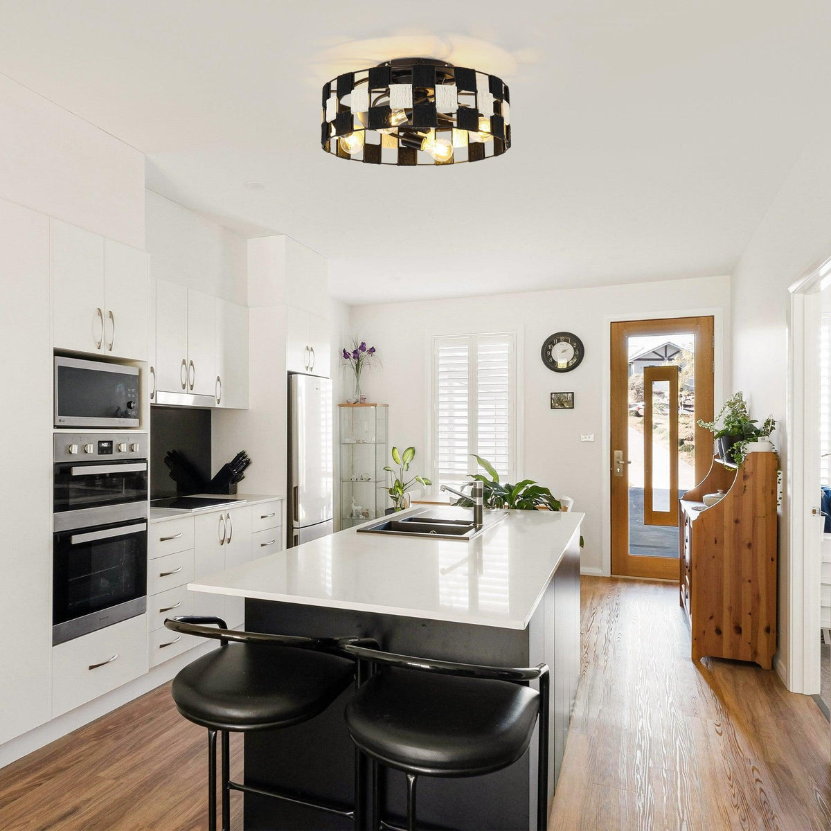 Black flush mount ceiling fan with light in a modern room ceiling