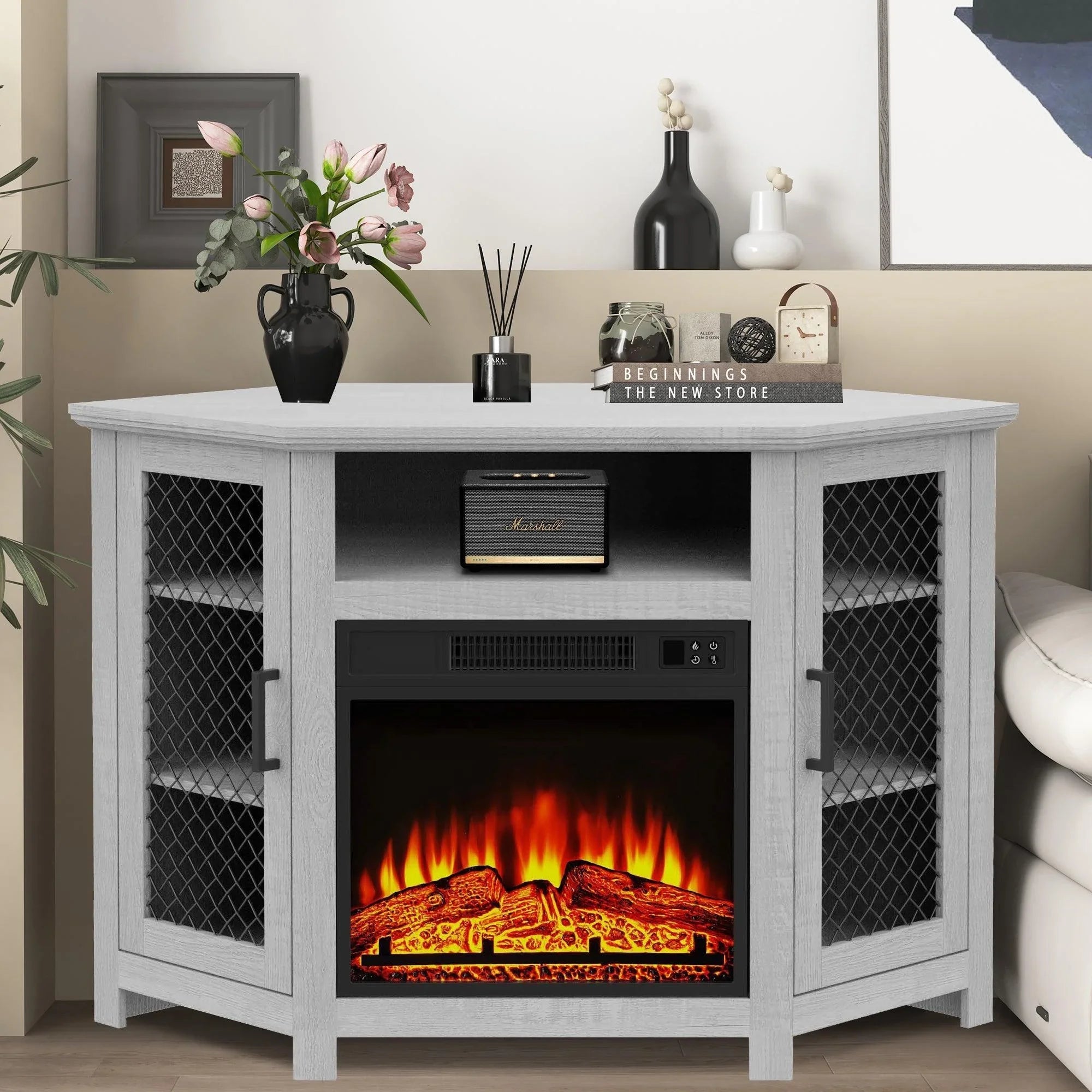 Grey electric fireplace TV stand with mesh doors and glowing flame insert