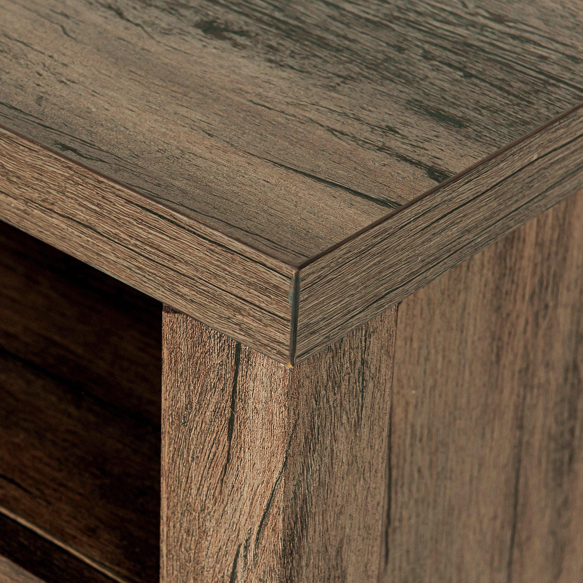 Dark brown nightstand corner joint with visible wood grain and beveled trim