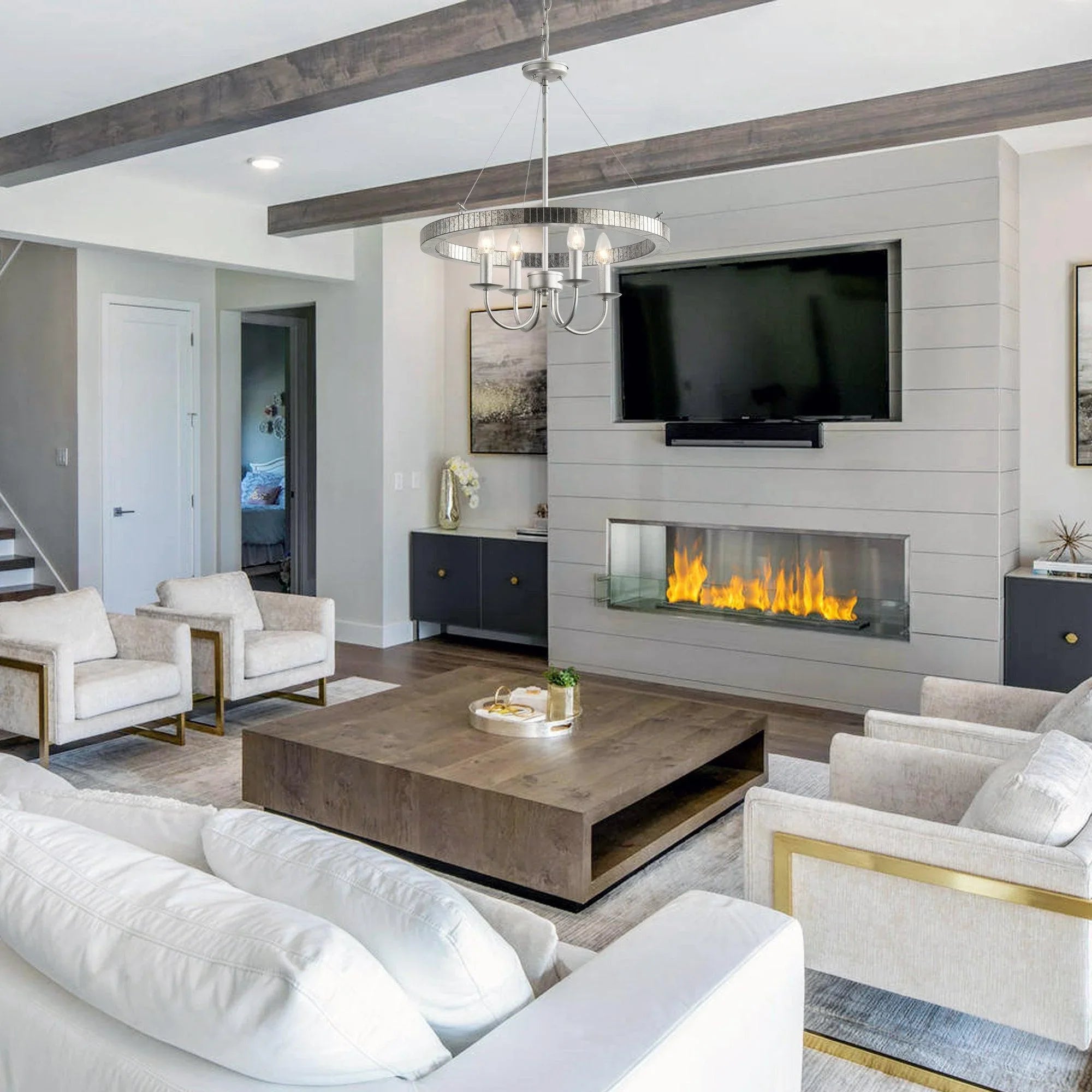 Satin nickel 4-light pendant with round textured ring and four arms above living room