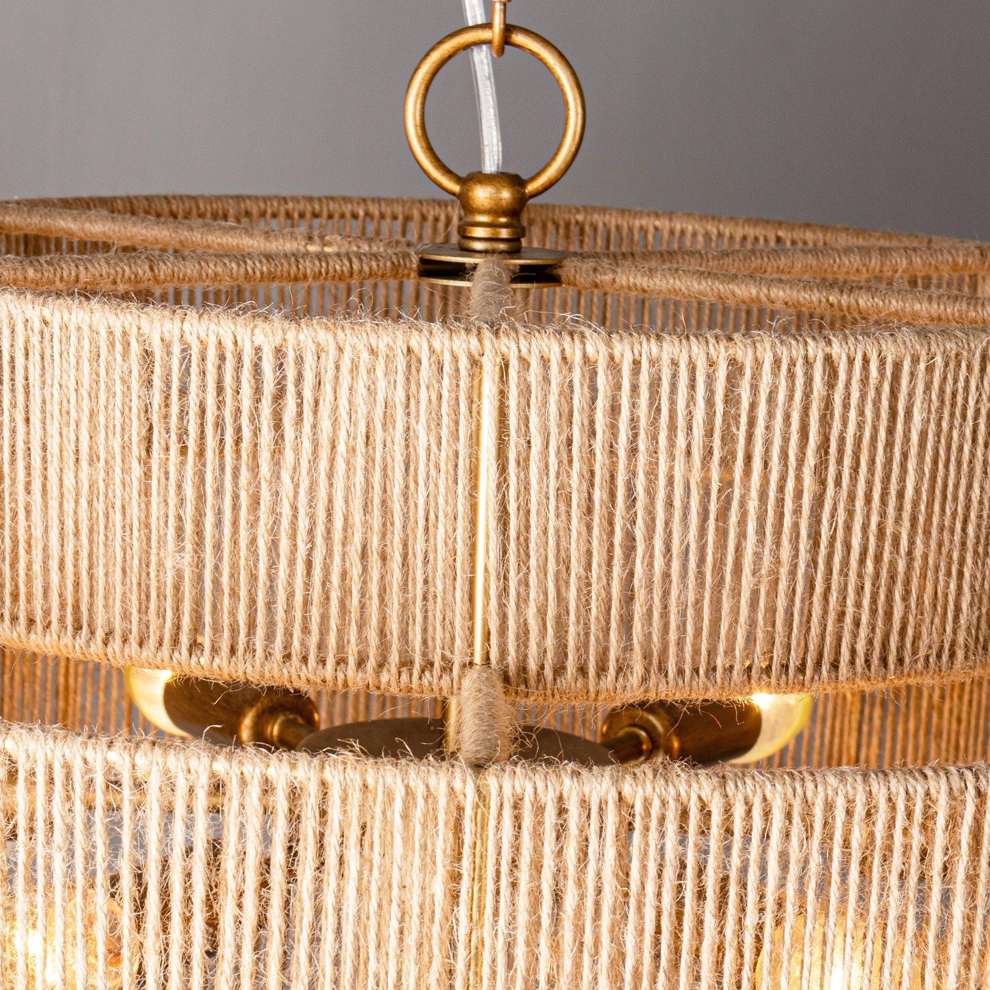 Antique gold finial and chain at top of natural rope drum chandelier