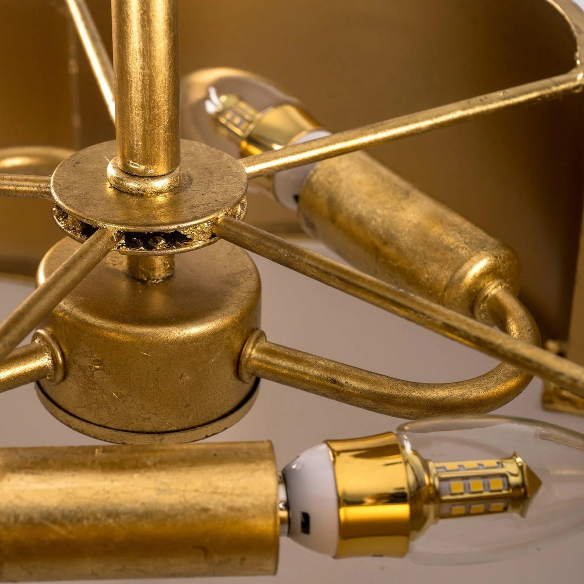 Golden mounting base with three bulb sockets and clear tube-style bulbs