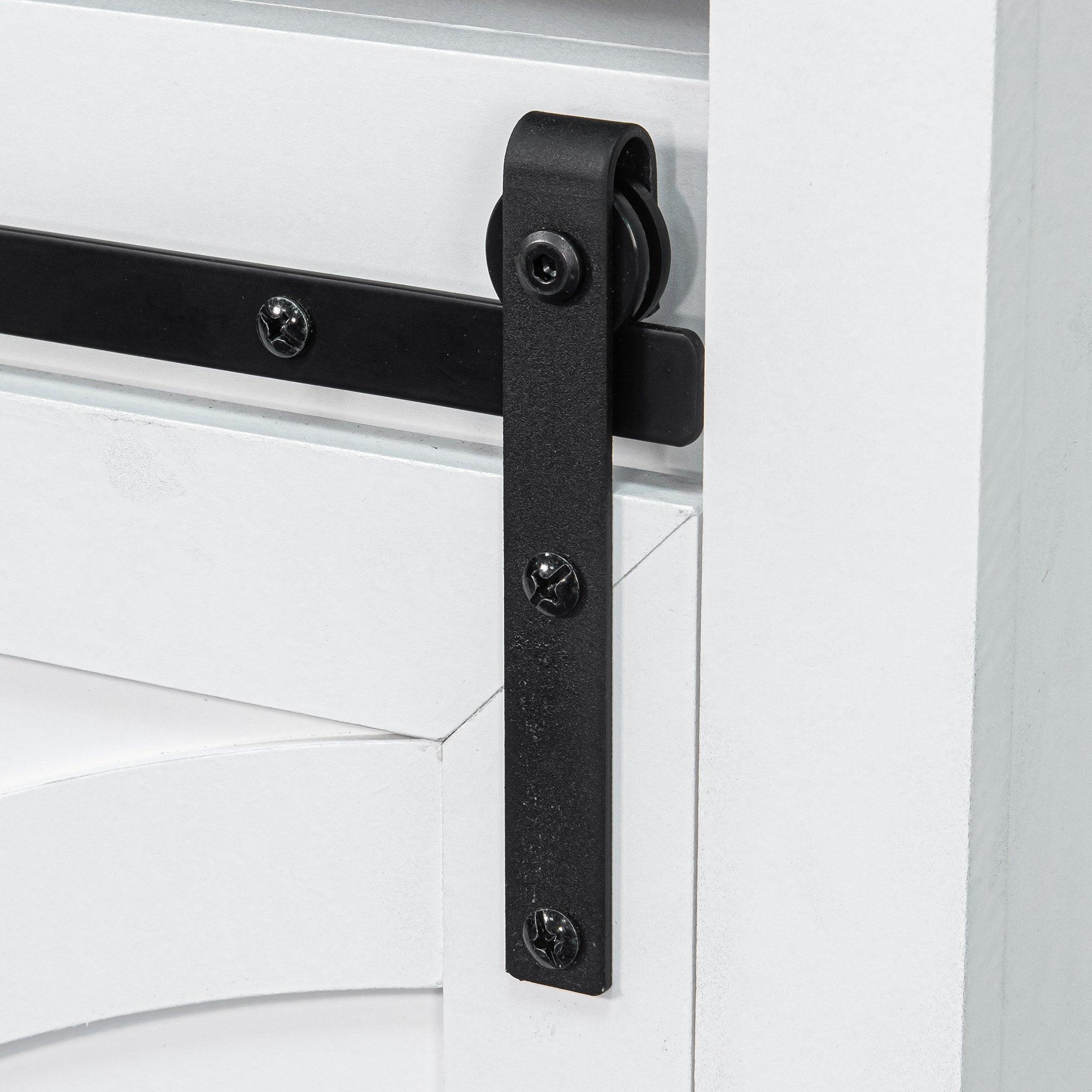 Close-up of black sliding barn door hardware on white TV stand