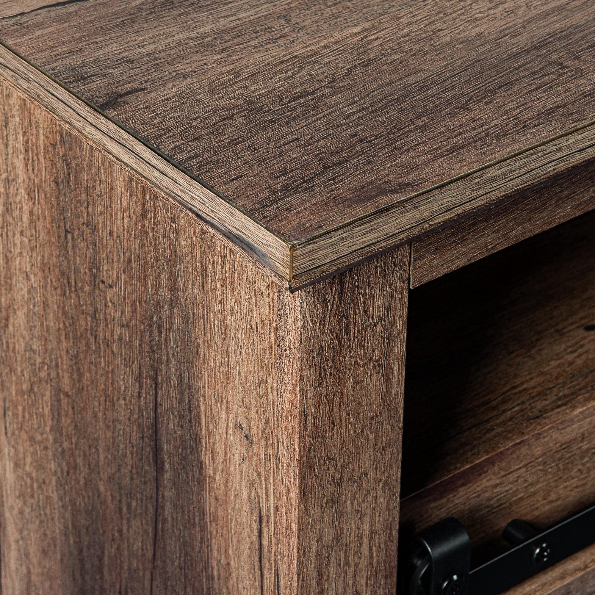 Dark wood TV stand cabinet corner with black hardware and open interior