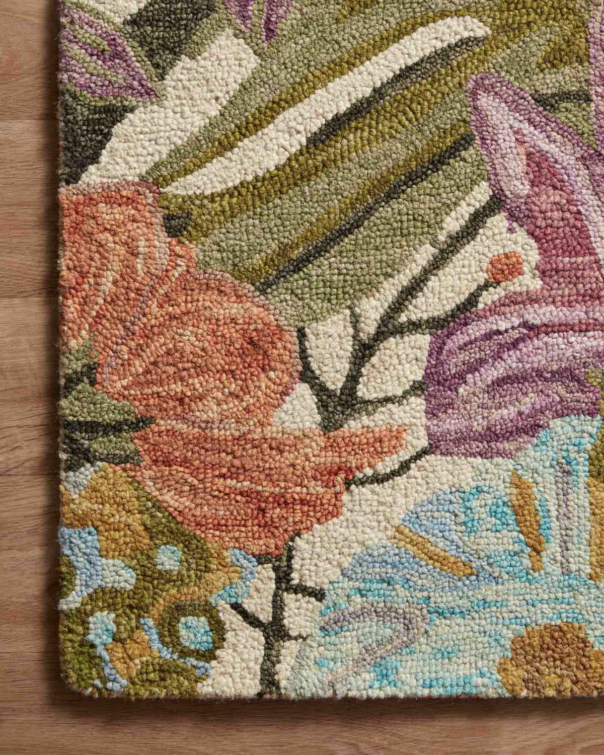 Close-up of ivory floral accent rug texture with leaf and flower motifs