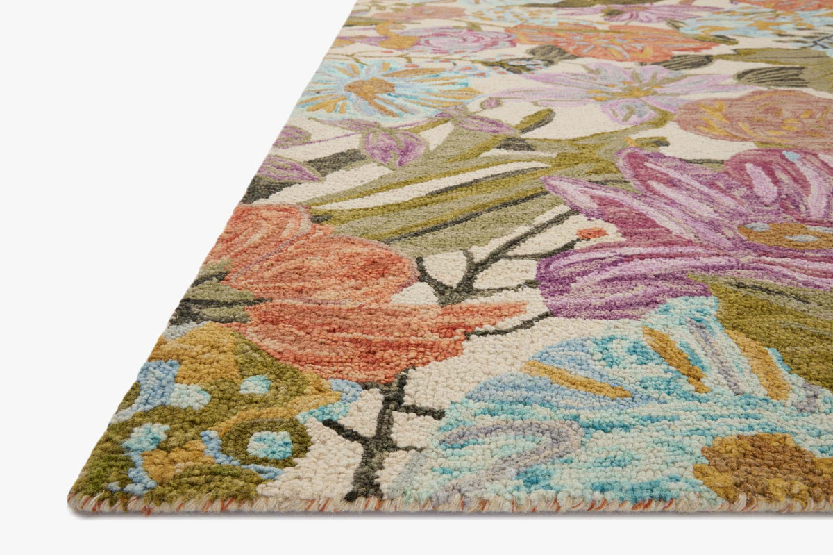 Ivory accent rug with multicolor floral and leaf pattern, angled corner view