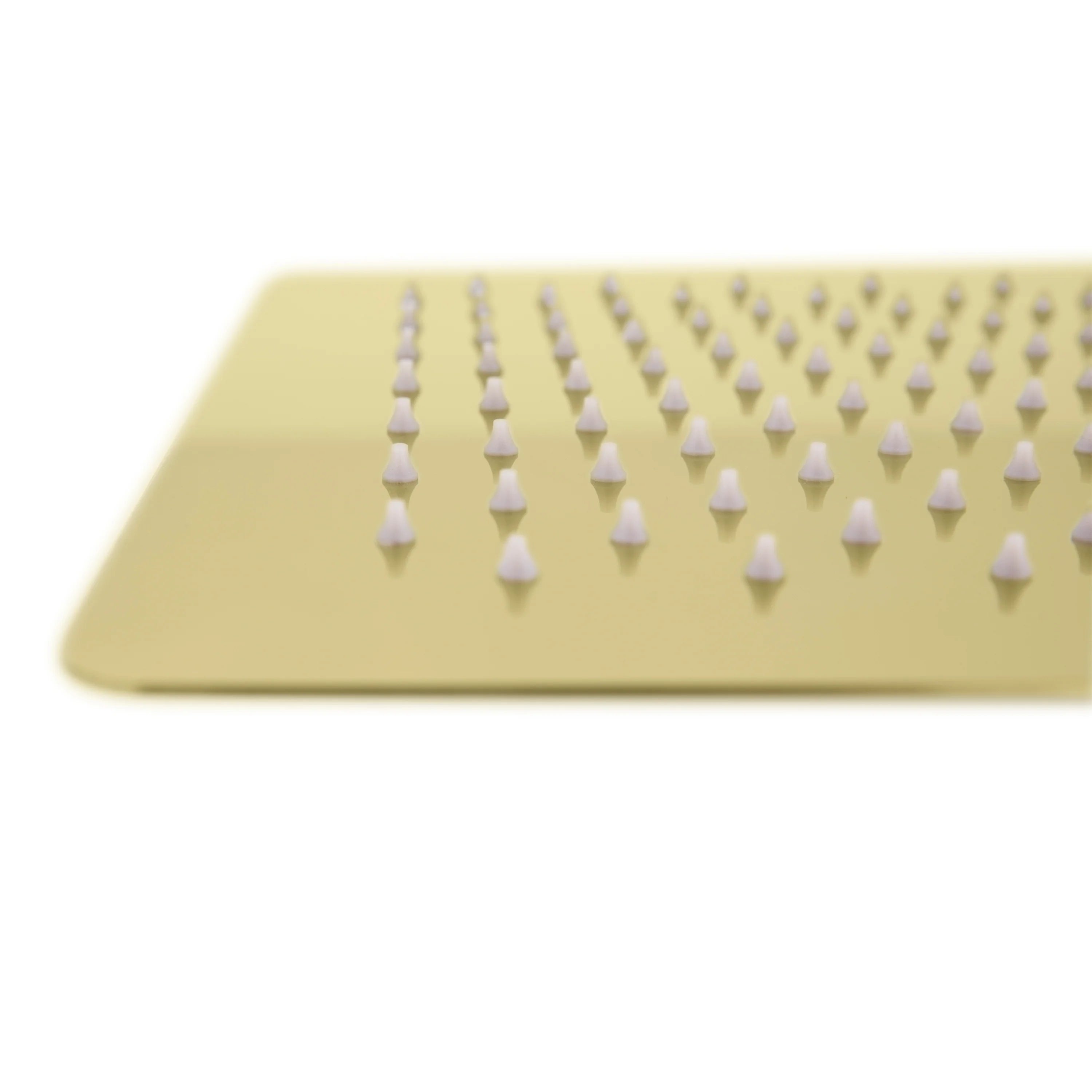 Gold shower head face with evenly spaced nozzles for spray