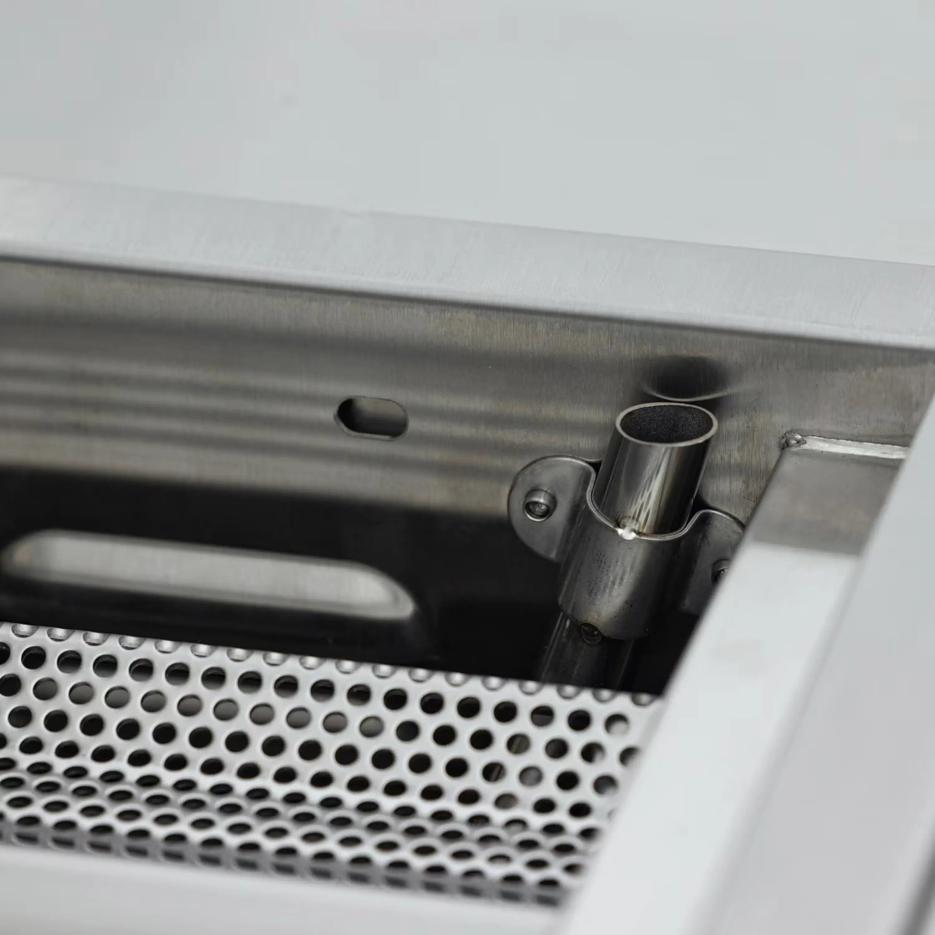 Inside rear infrared burner area with stainless components and vented panel