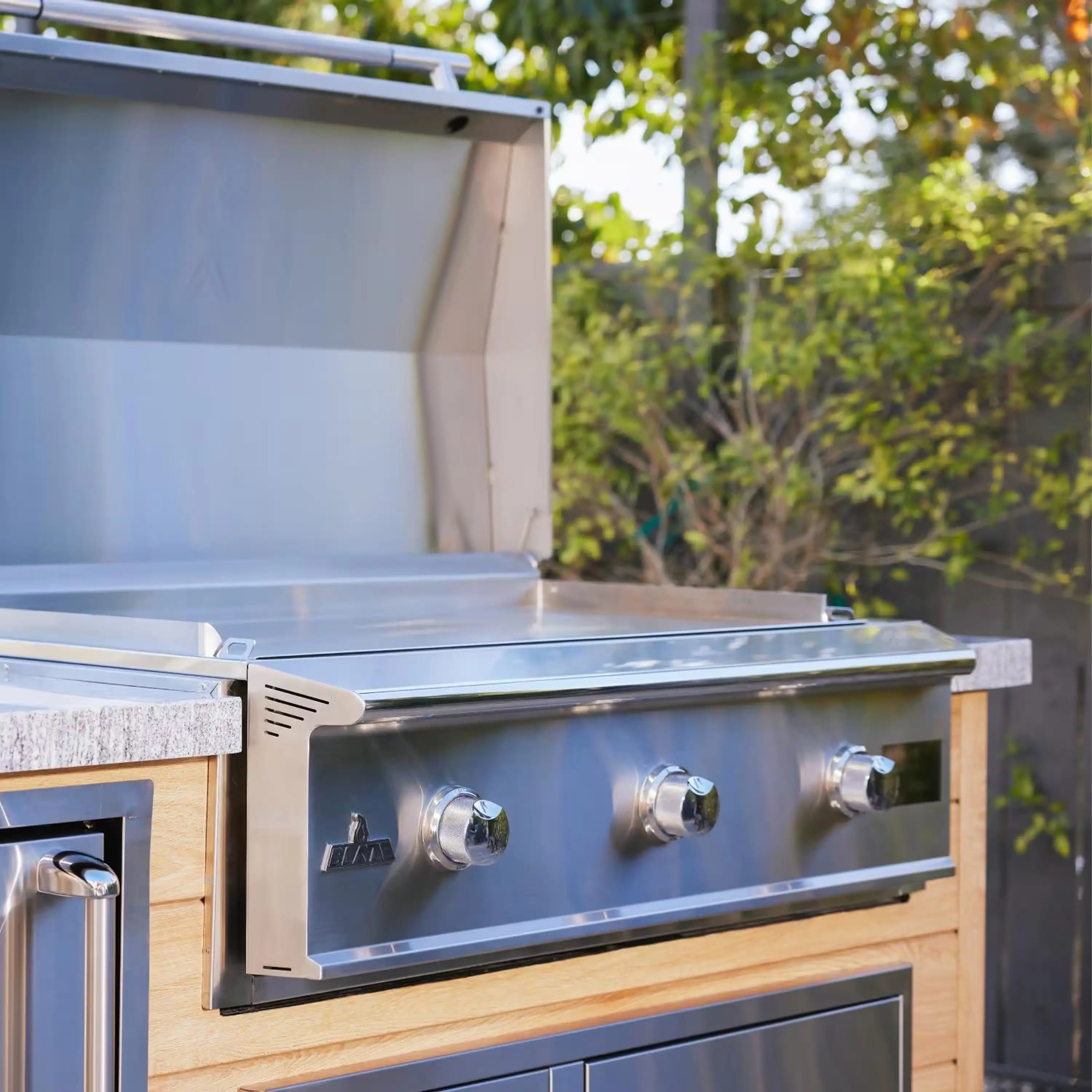 Stainless steel propane gas griddle control panel with three chrome knobs