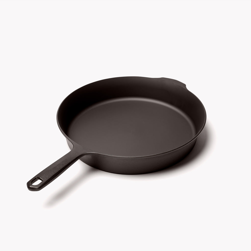 11 5/8 in cast iron skillet, dark interior and exterior, short loop handle.
