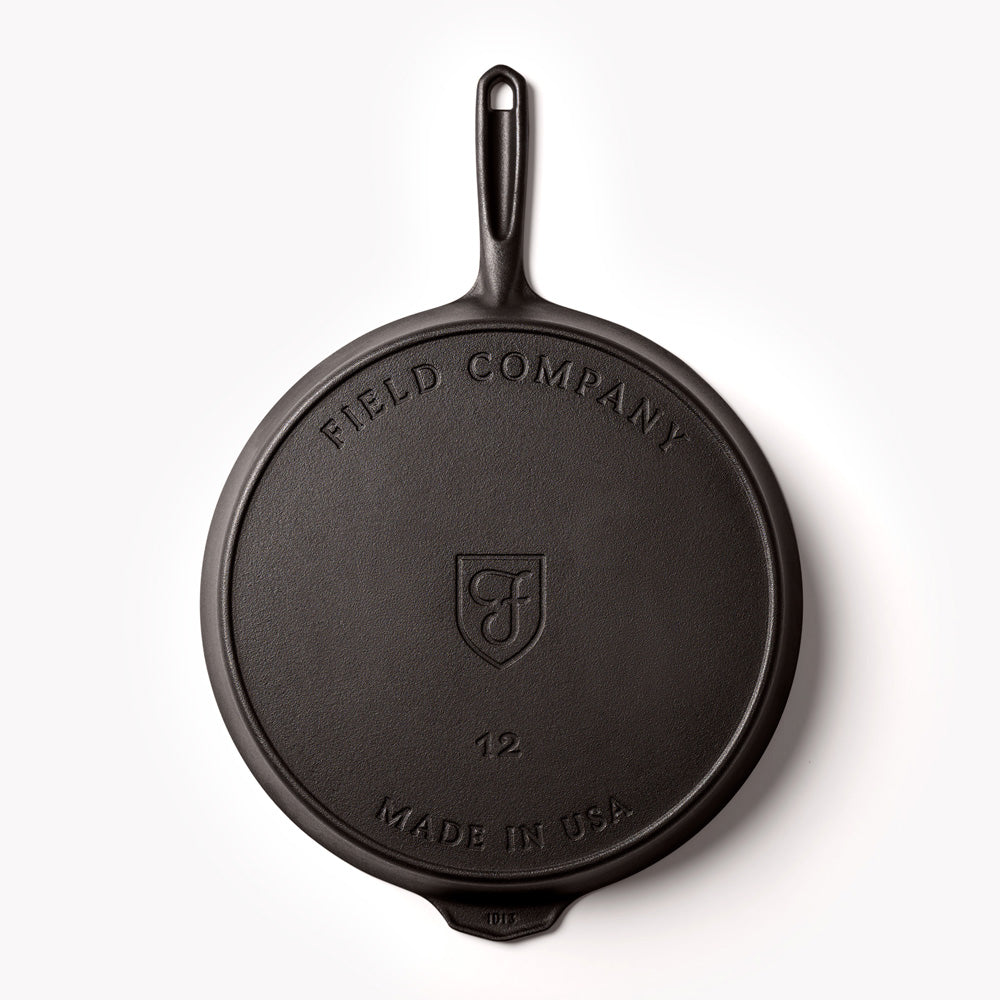 Underside of Field Company cast iron skillet with branding and hanging loop