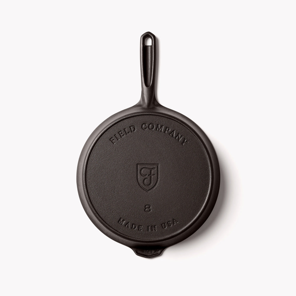 Field Company cast iron skillet base with molded logo and loop handle