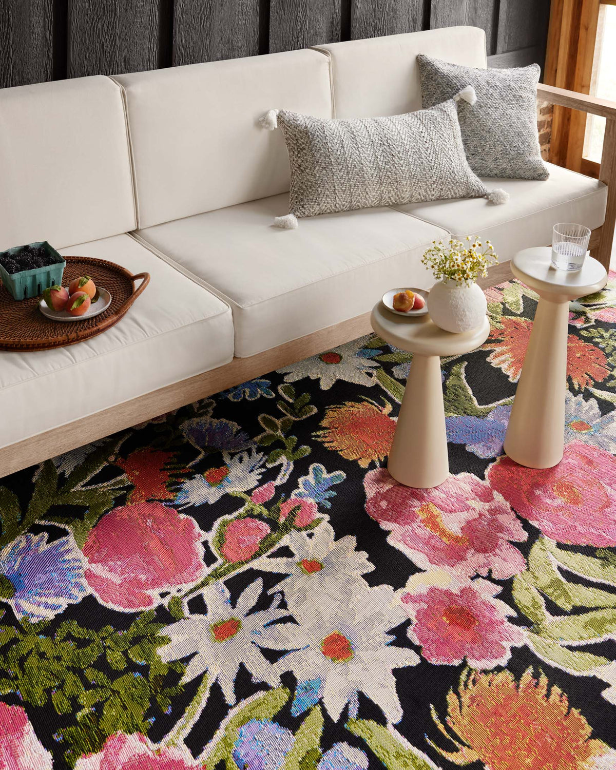 Floral botanical runner rug with pink blossoms and green leaves on dark ground