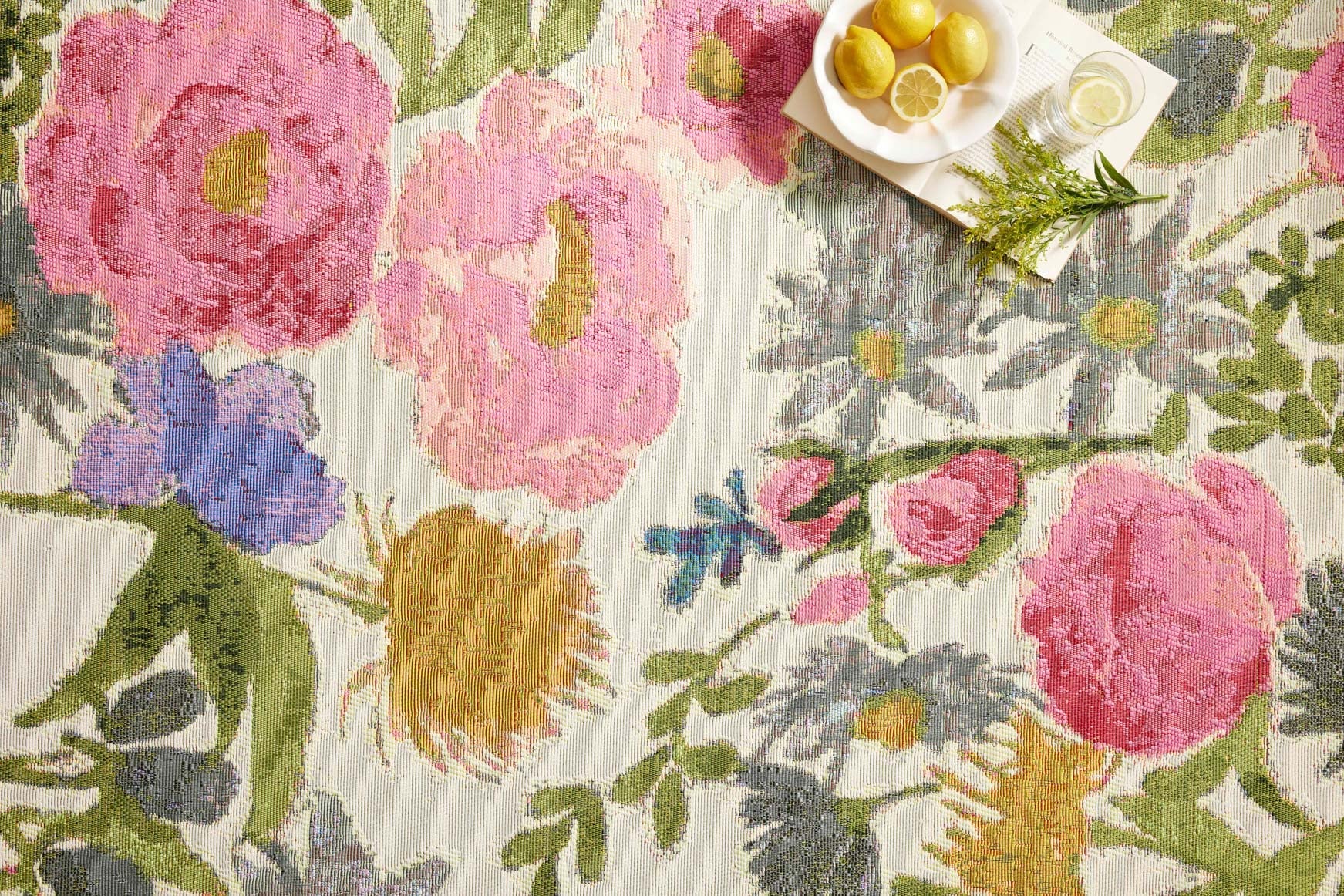 Botanical runner rug close-up of pink, blue, and green flowers on ivory ground