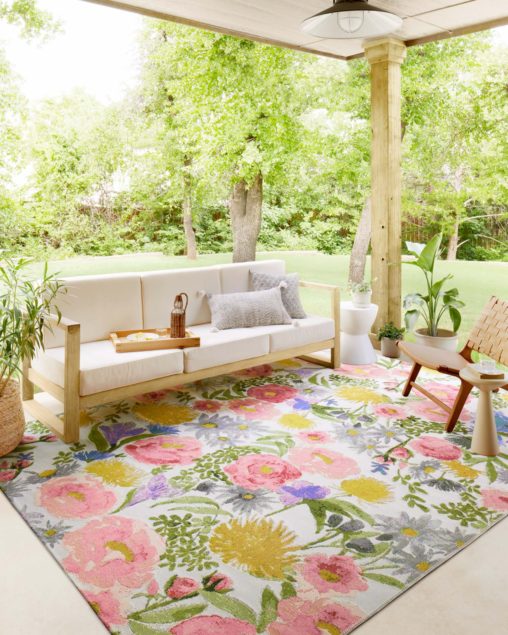 Botanical indoor/outdoor accent rug with multicolor flowers on light ground
