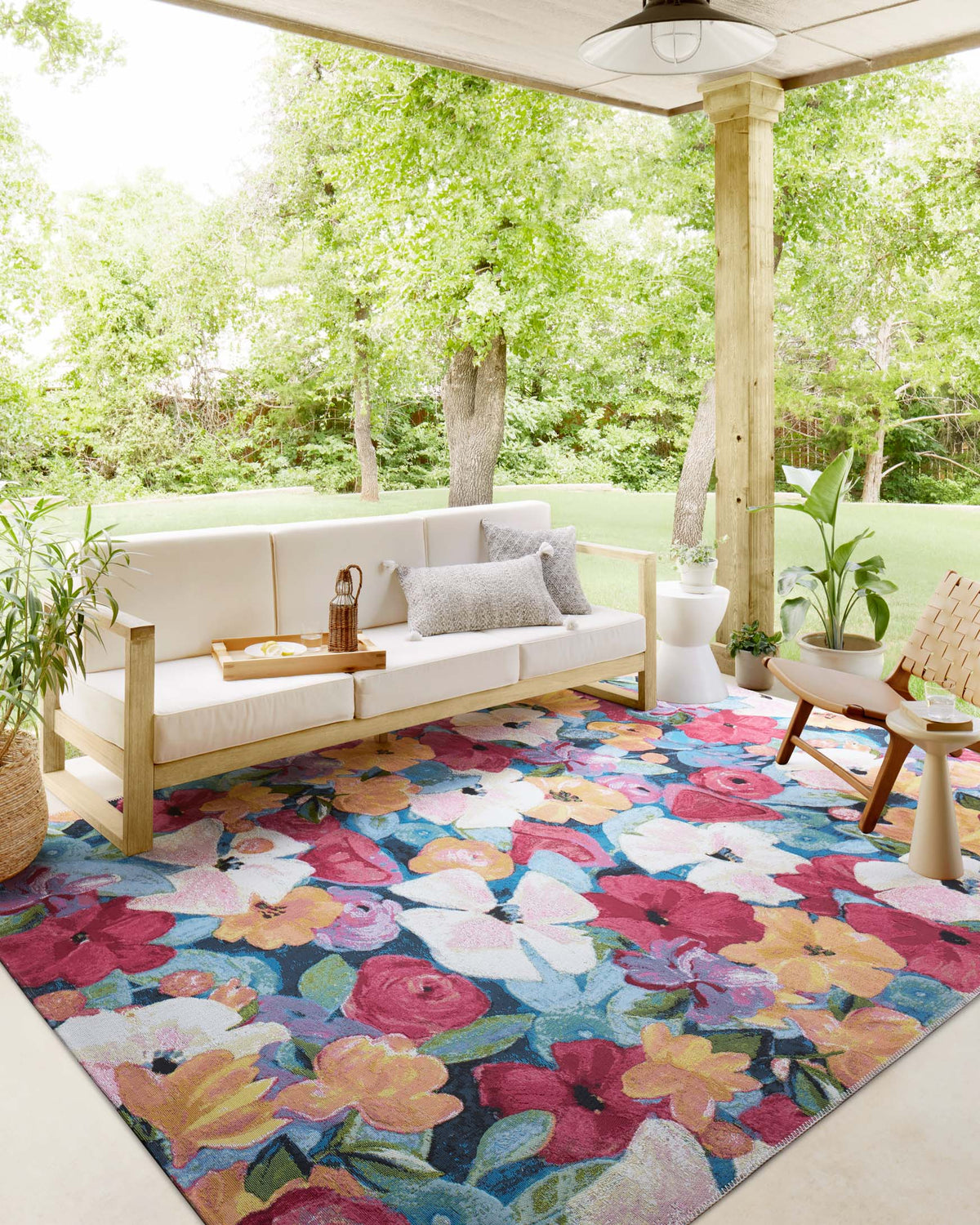 Multicolor floral round accent rug outdoors in a patio setting